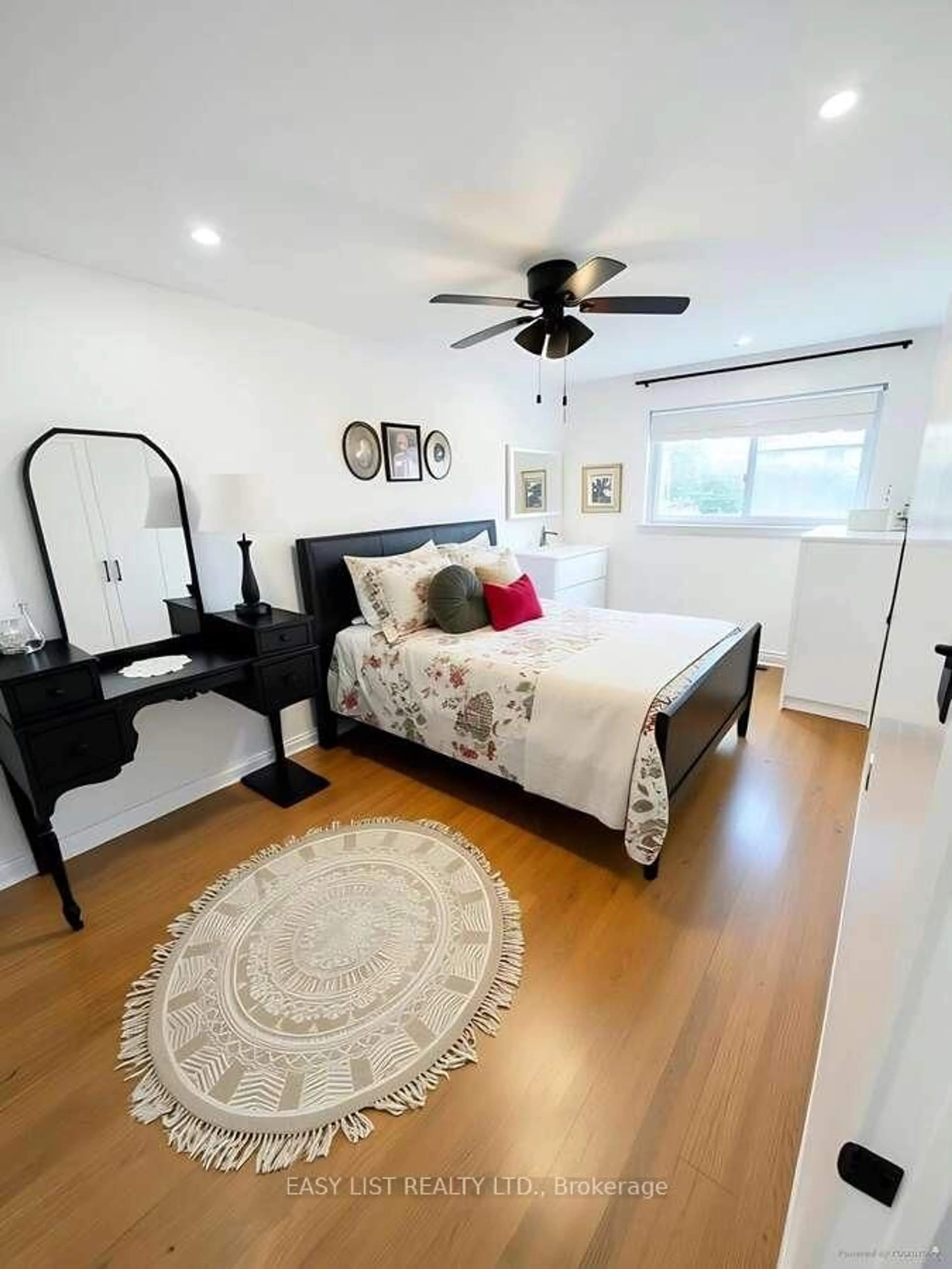 Bedroom with bed, wood/laminate floor for 24 Elmvale Cres, Toronto Ontario M9V 2B9