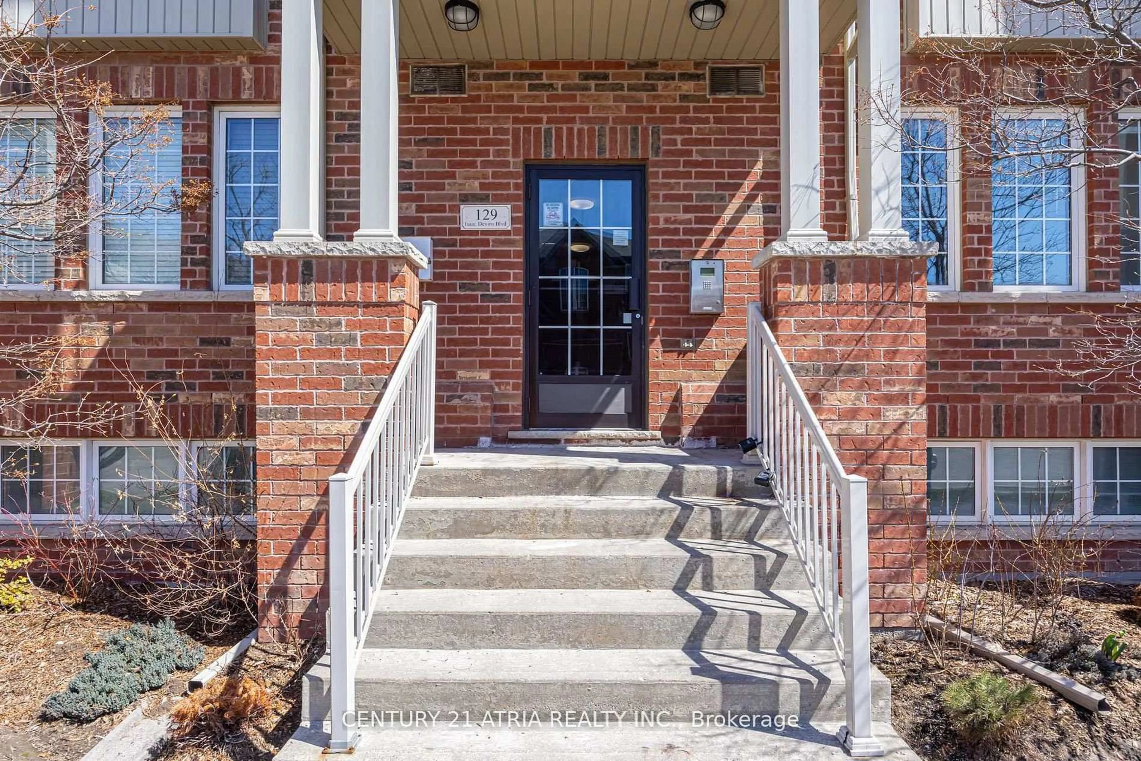 Home with brick exterior material, street for 129 Isaac Devins Blvd #5, Toronto Ontario M9M 0C4