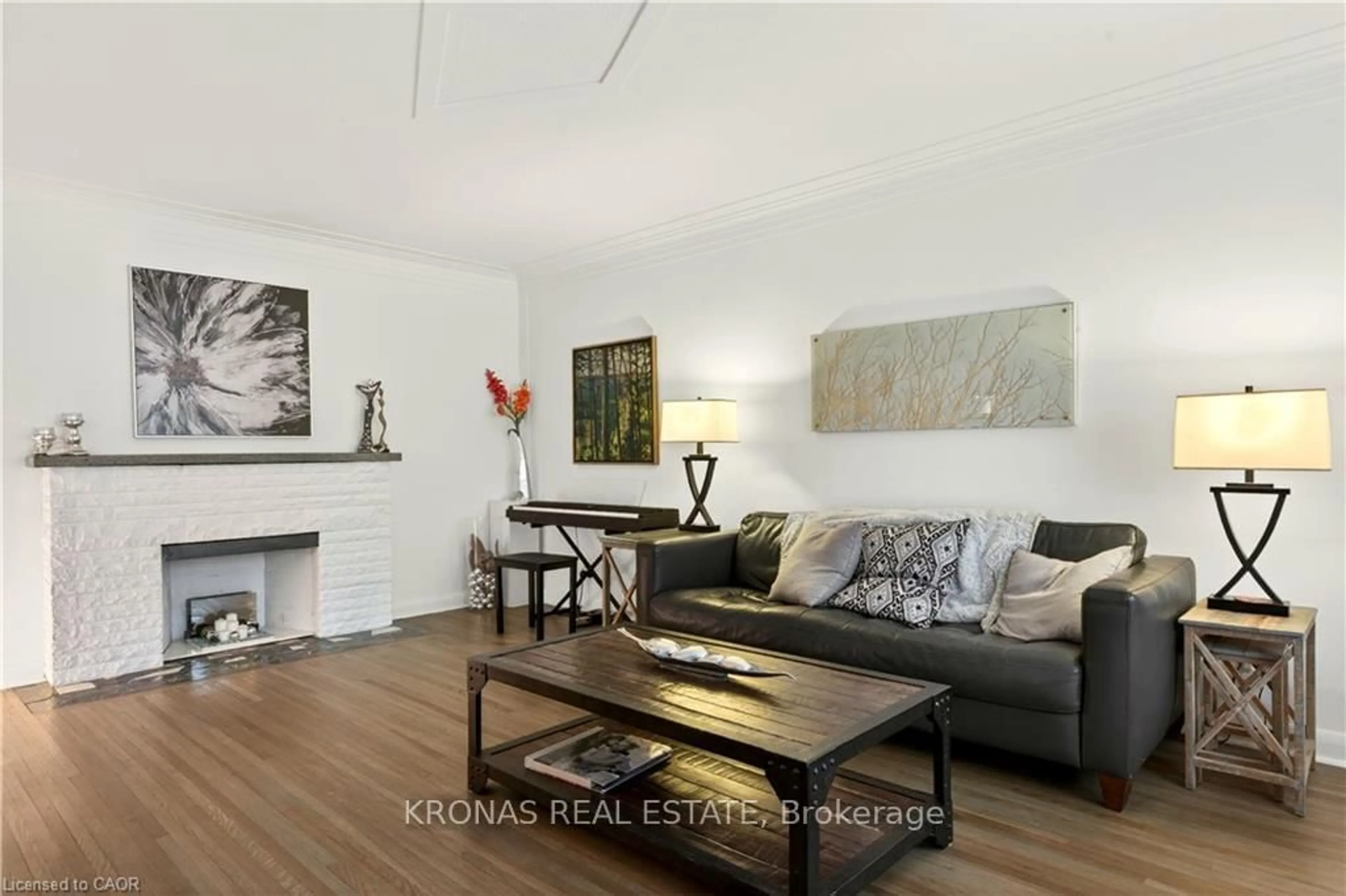Living room with furniture, wood/laminate floor for 1216 Fisher Ave, Burlington Ontario L7P 2L4