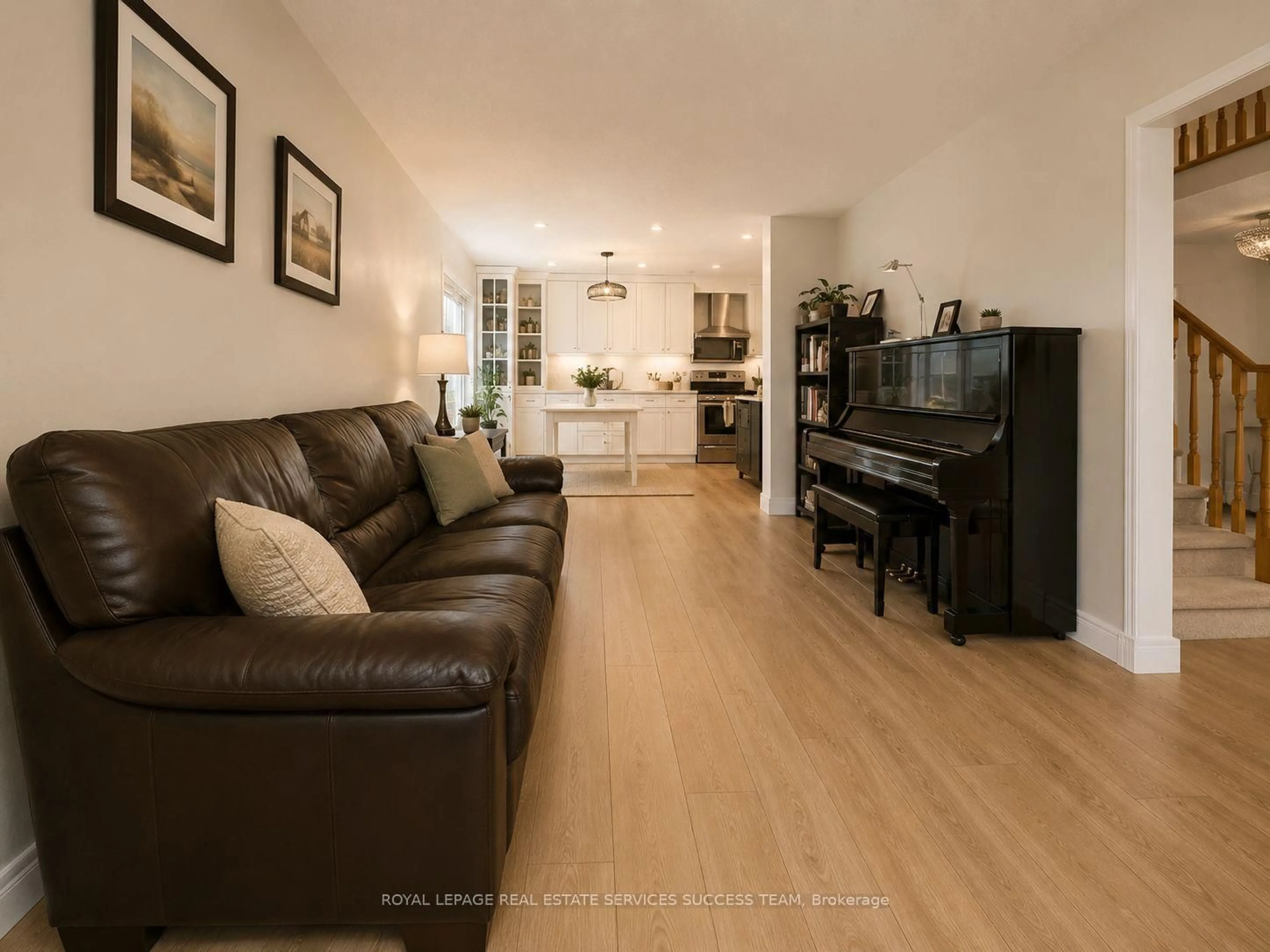 Living room with furniture, wood/laminate floor for 2360 Credit Valley Rd, Mississauga Ontario L5M 4C9