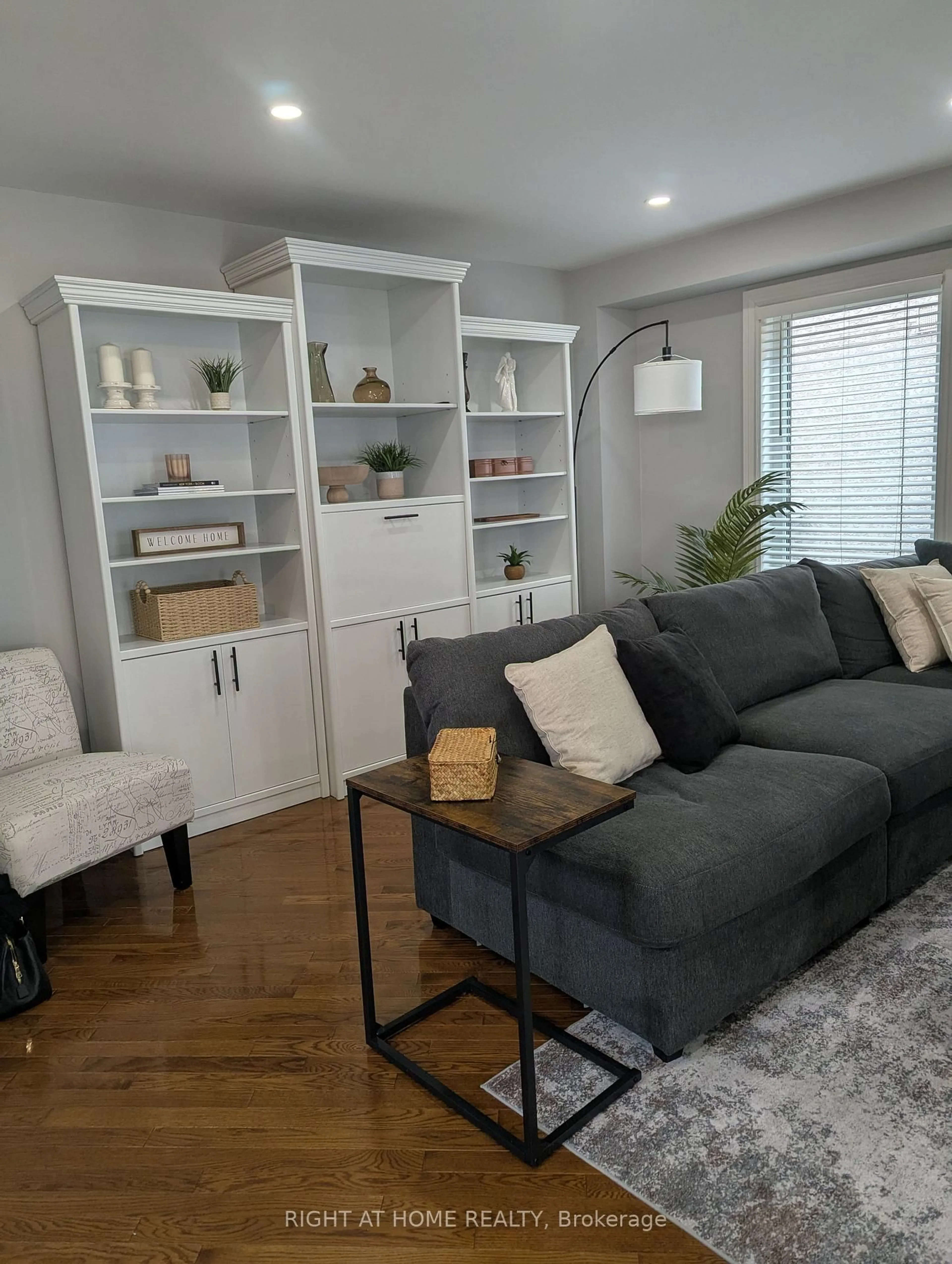 Living room with furniture, wood/laminate floor for 12 Frustac Tr, Caledon Ontario L7E 1Y5