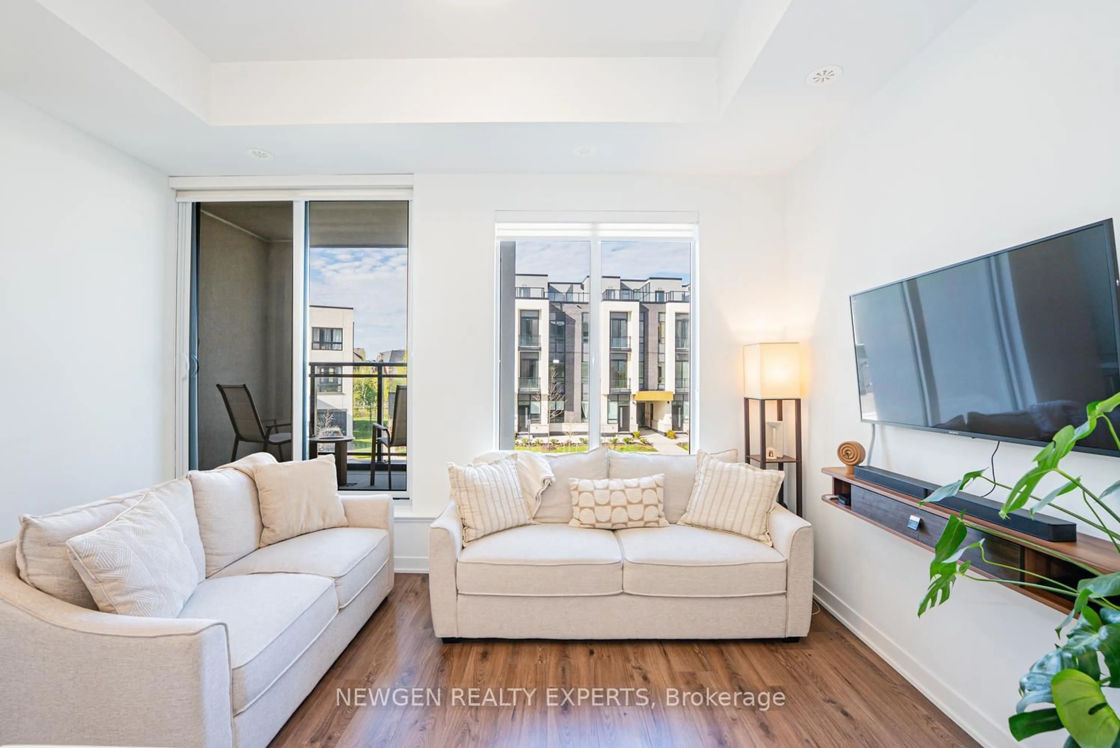 Living room with furniture, unknown for 3020 Trailside Dr #129, Oakville Ontario L6M 4M2