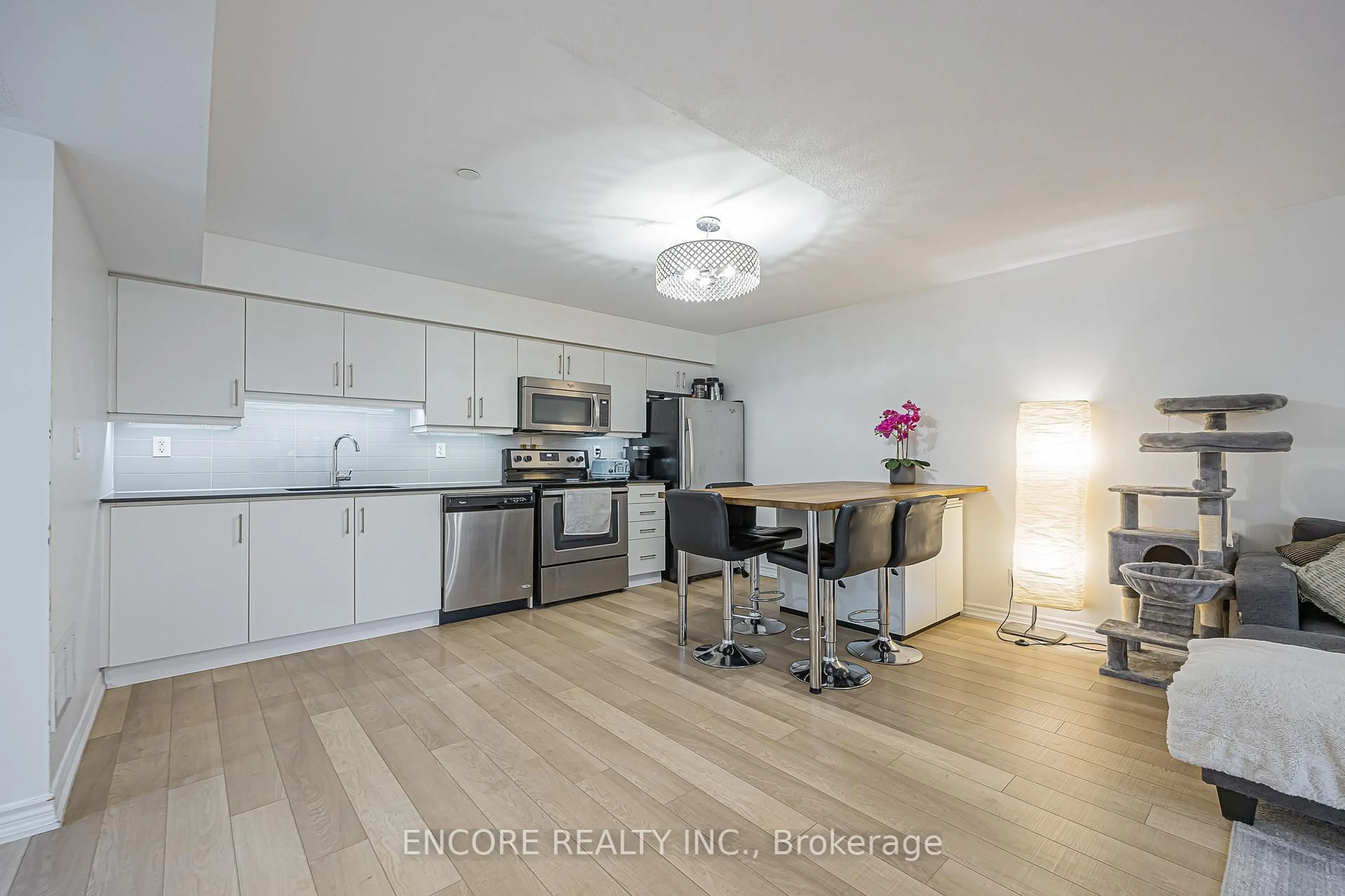 Open concept kitchen, wood/laminate floor for 10 Carnation Ave #8, Toronto Ontario M8V 0B8