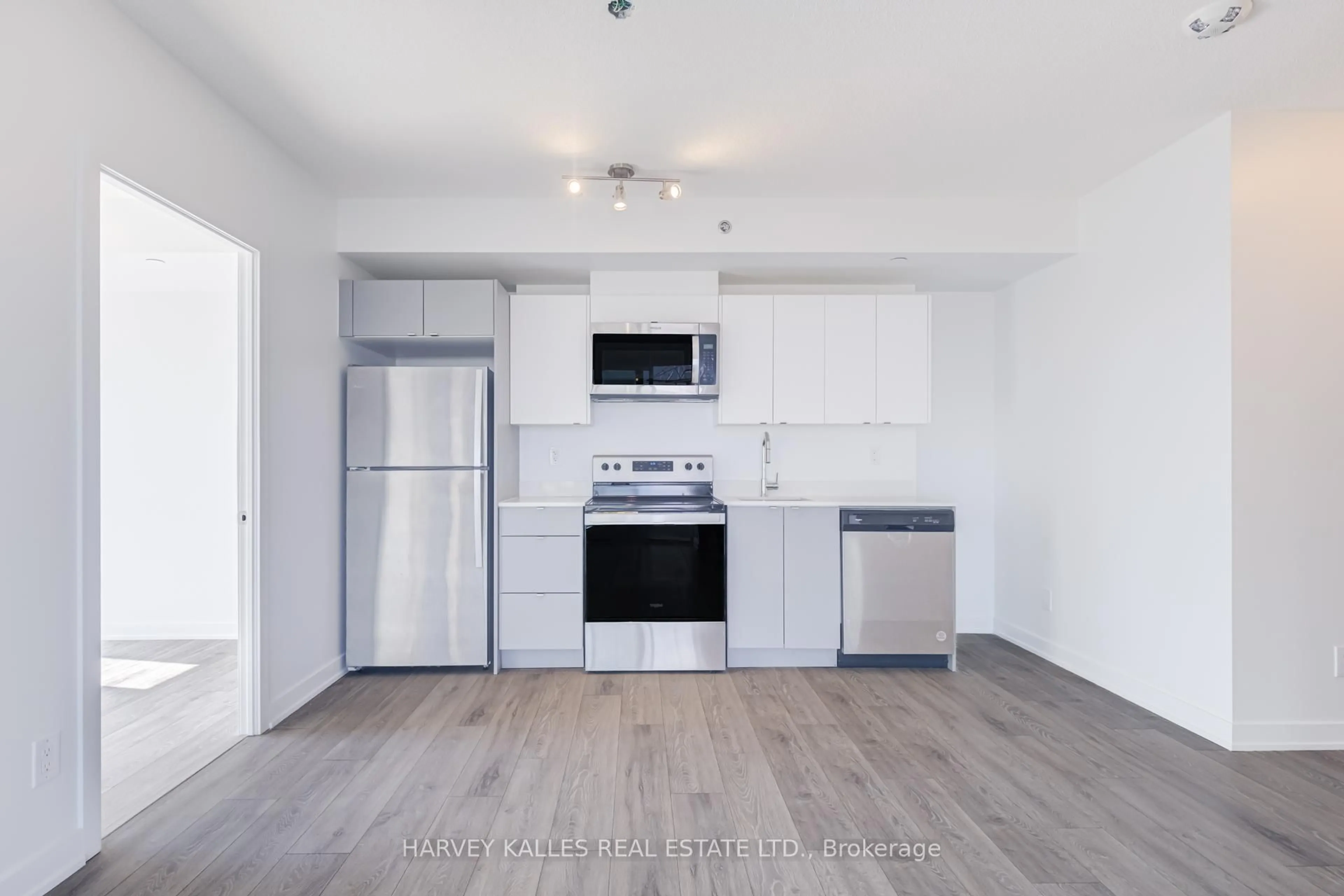 Open concept kitchen, wood/laminate floor for 3200 Dakota Common #B814, Burlington Ontario L7M 2A7