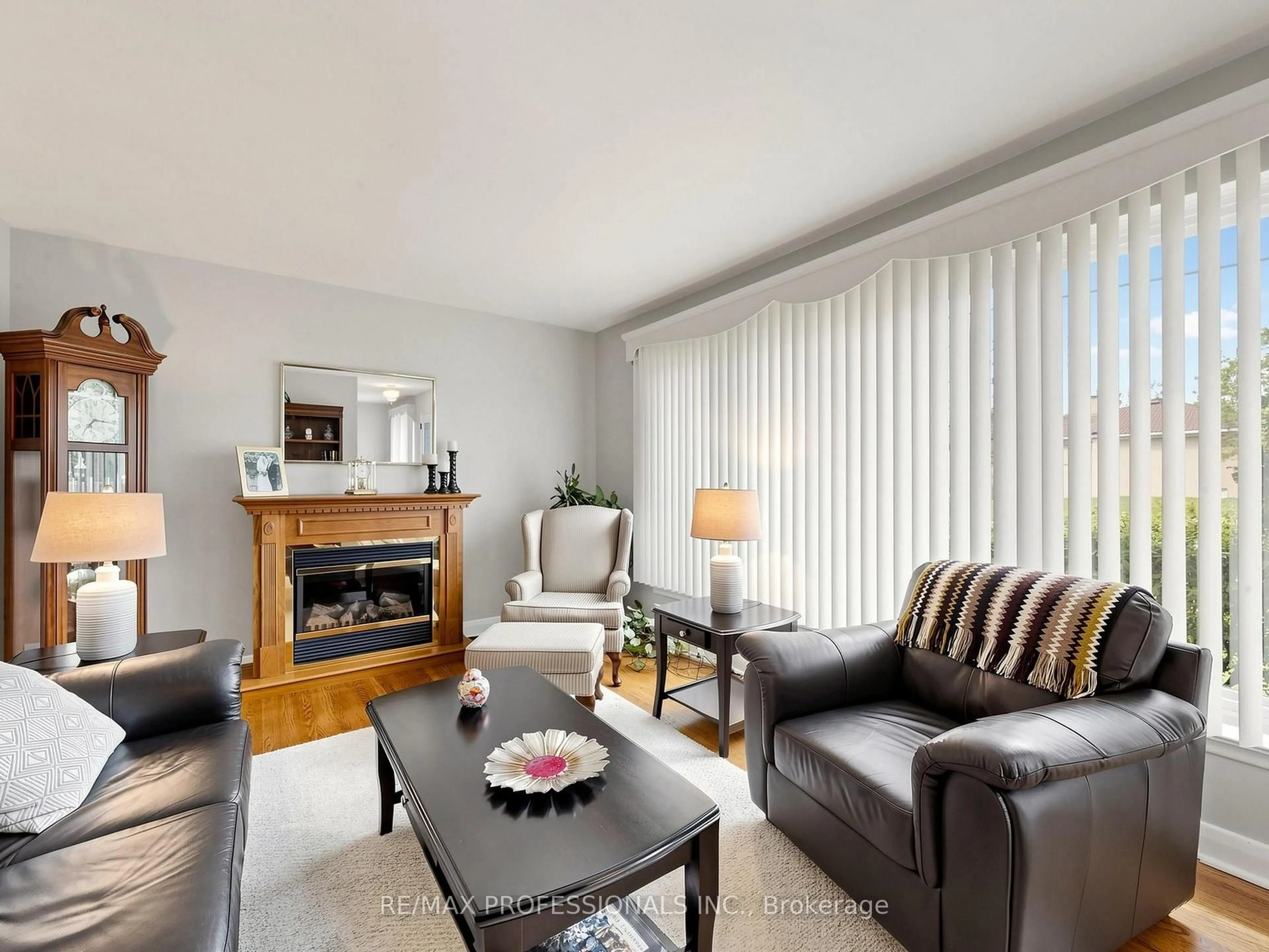 Living room with furniture, wood/laminate floor for 177 Elmhurst Dr, Toronto Ontario M9W 2L2