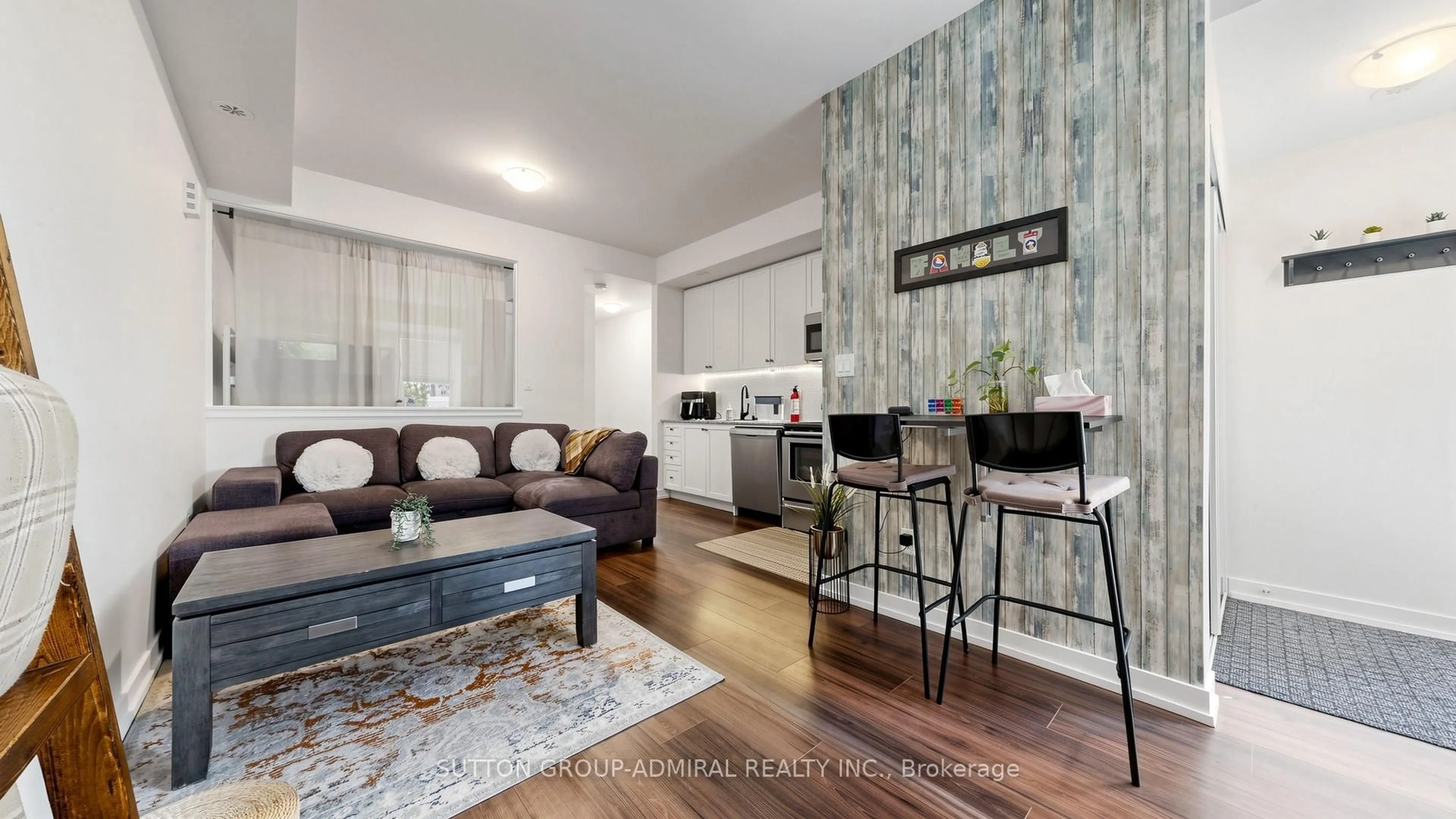 Living room with furniture, wood/laminate floor for 869 Wilson Ave #14, Toronto Ontario M3K 0A4