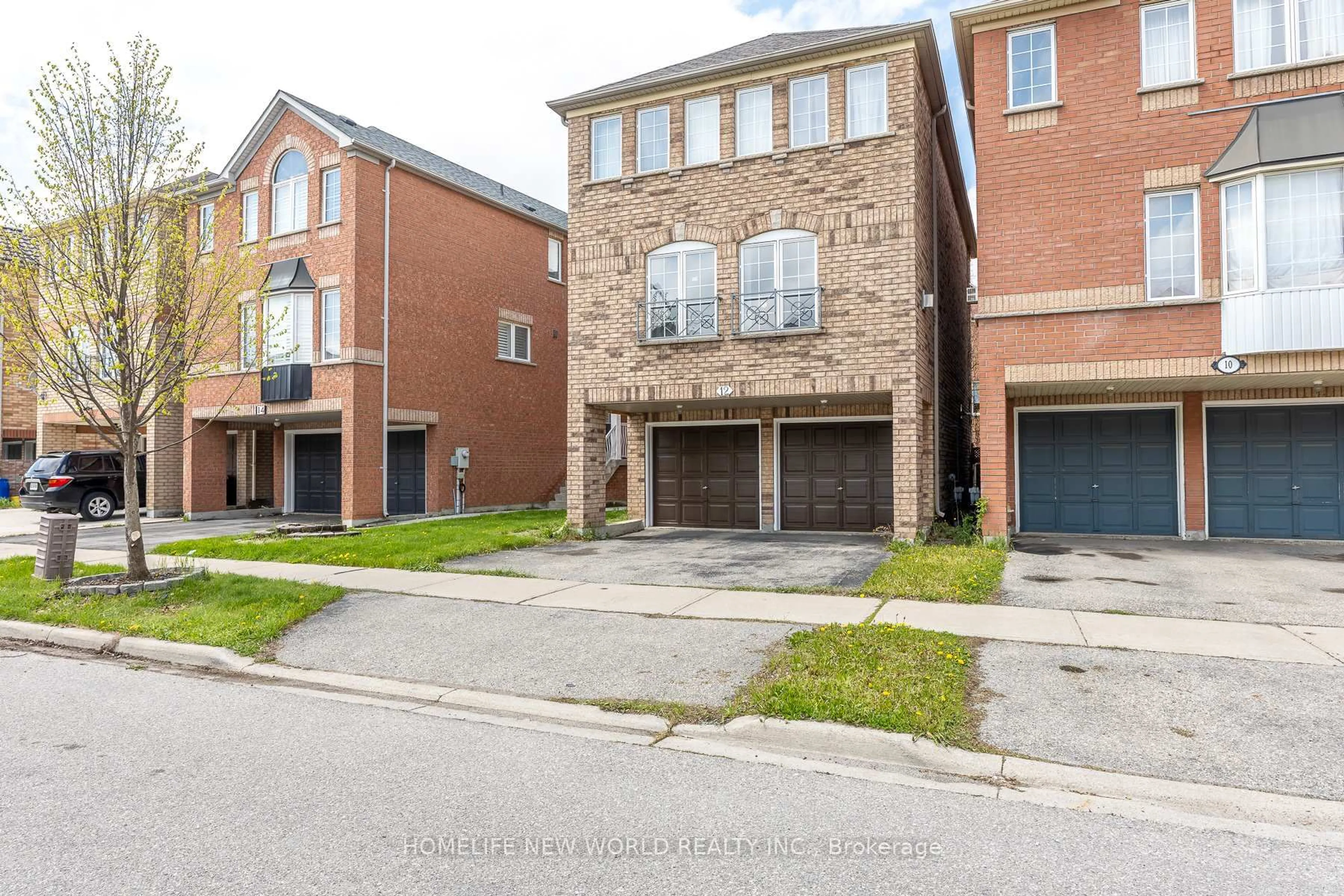 Home with brick exterior material, street for 12 Touchstone Dr, Toronto Ontario M6M 5L2