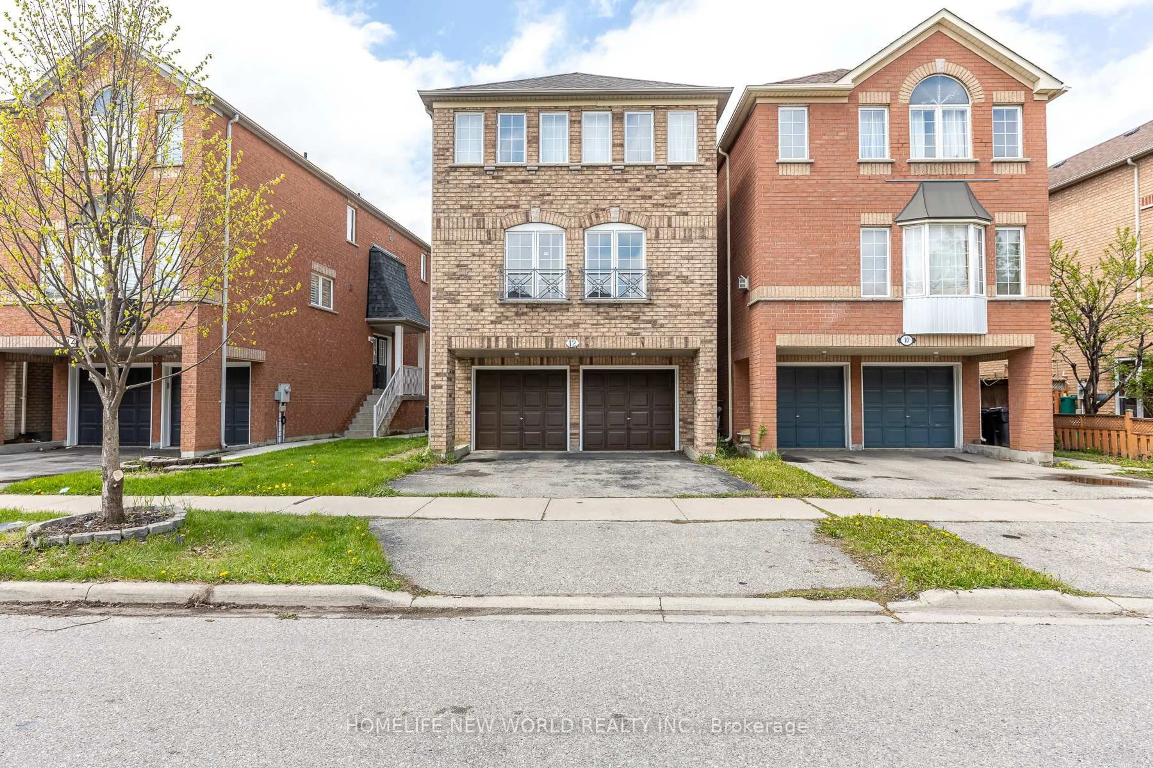 Home with brick exterior material, street for 12 Touchstone Dr, Toronto Ontario M6M 5L2
