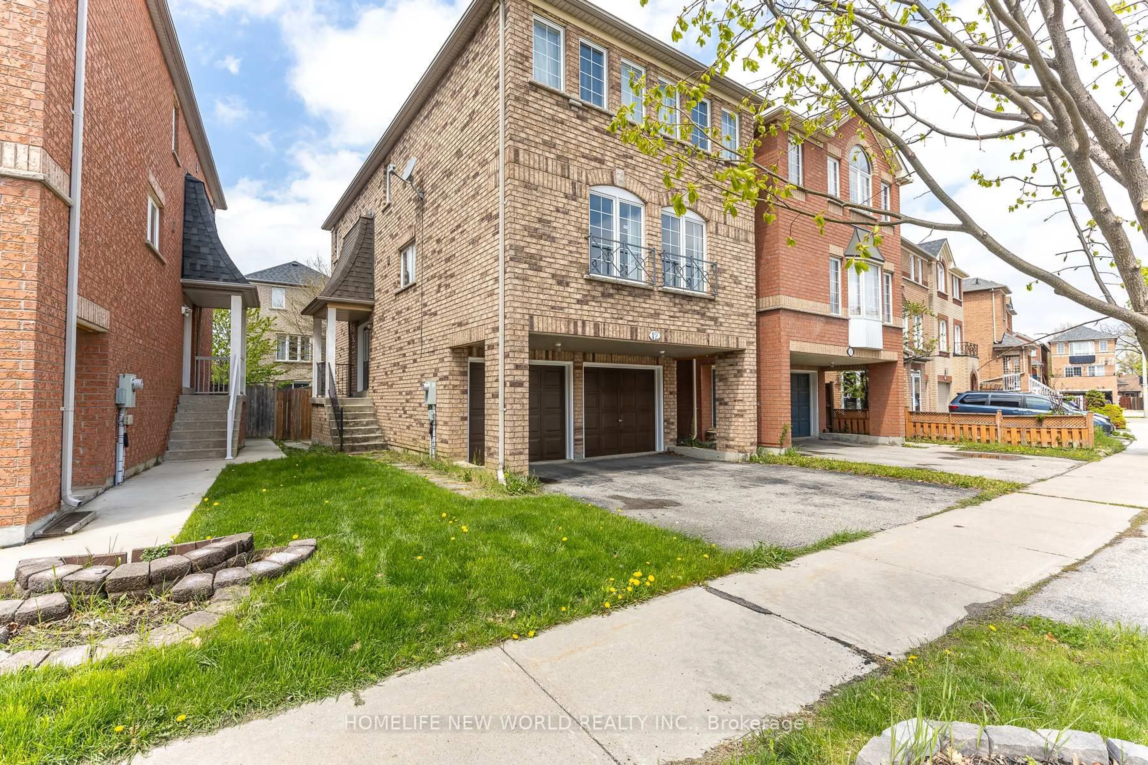Home with brick exterior material, street for 12 Touchstone Dr, Toronto Ontario M6M 5L2