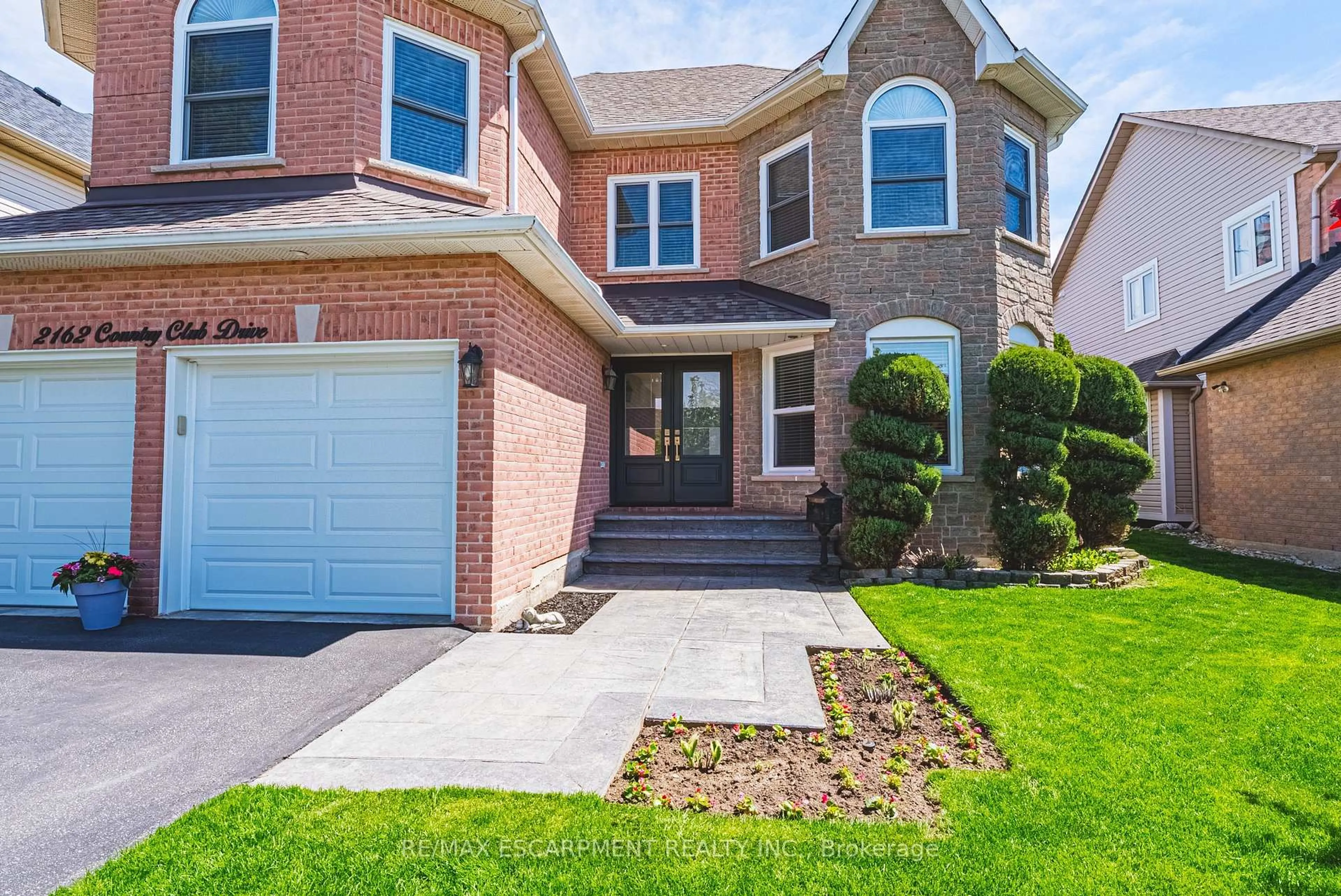 Home with brick exterior material, street for 2162 Country Club Dr, Burlington Ontario L7M 4B1