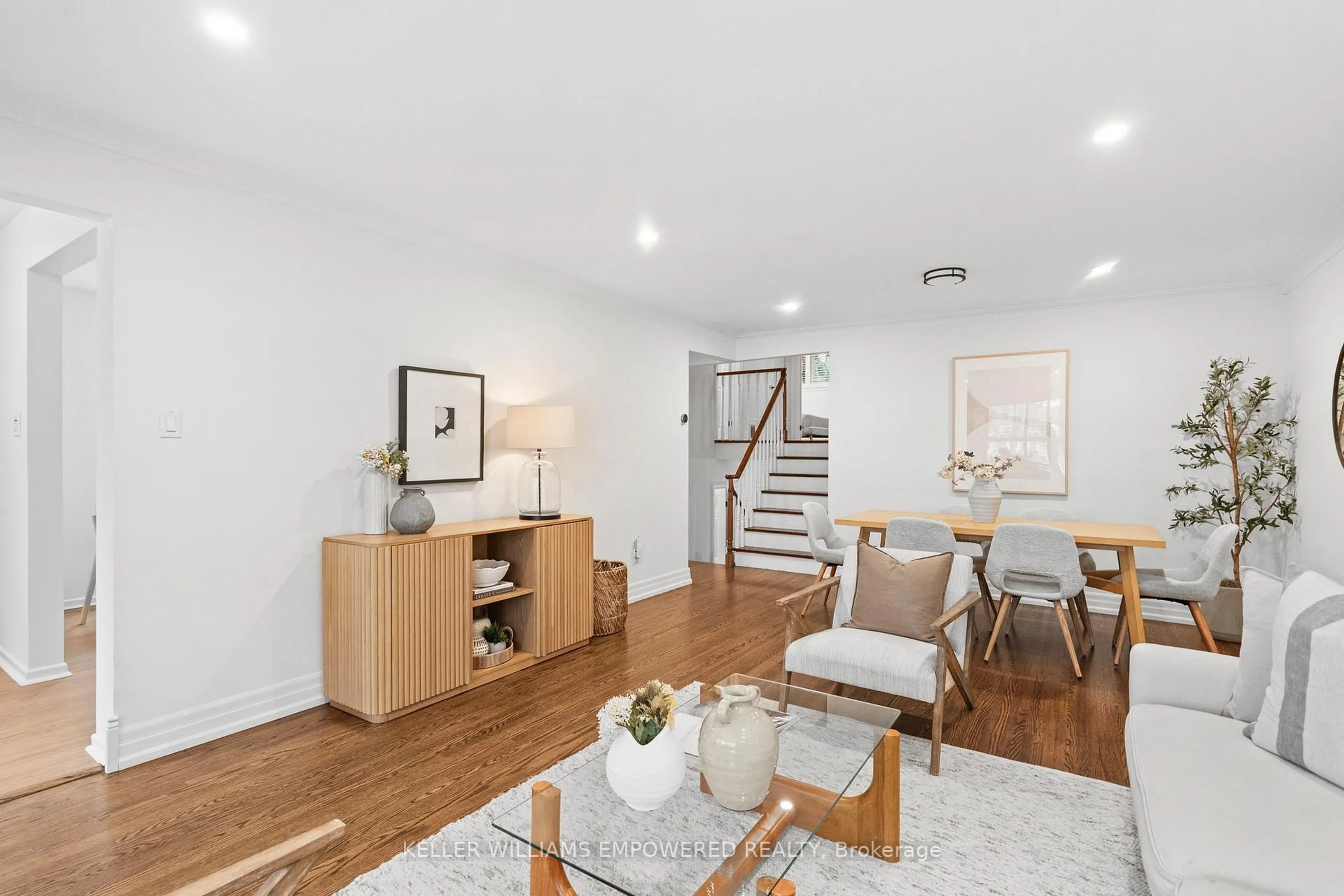 Living room with furniture, wood/laminate floor for 25 Bloorlea Cres, Toronto Ontario M9B 1P2