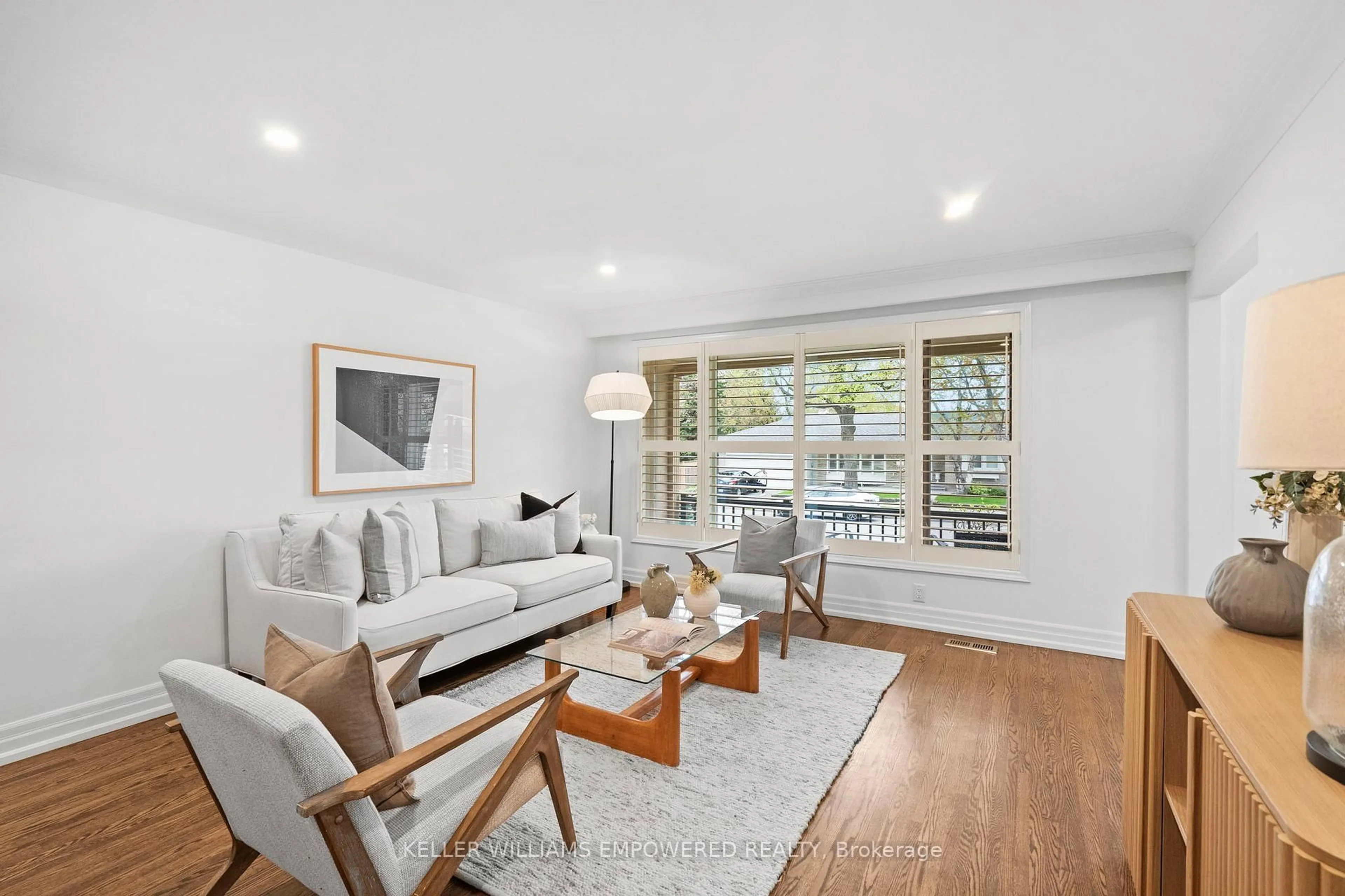Living room with furniture, wood/laminate floor for 25 Bloorlea Cres, Toronto Ontario M9B 1P2