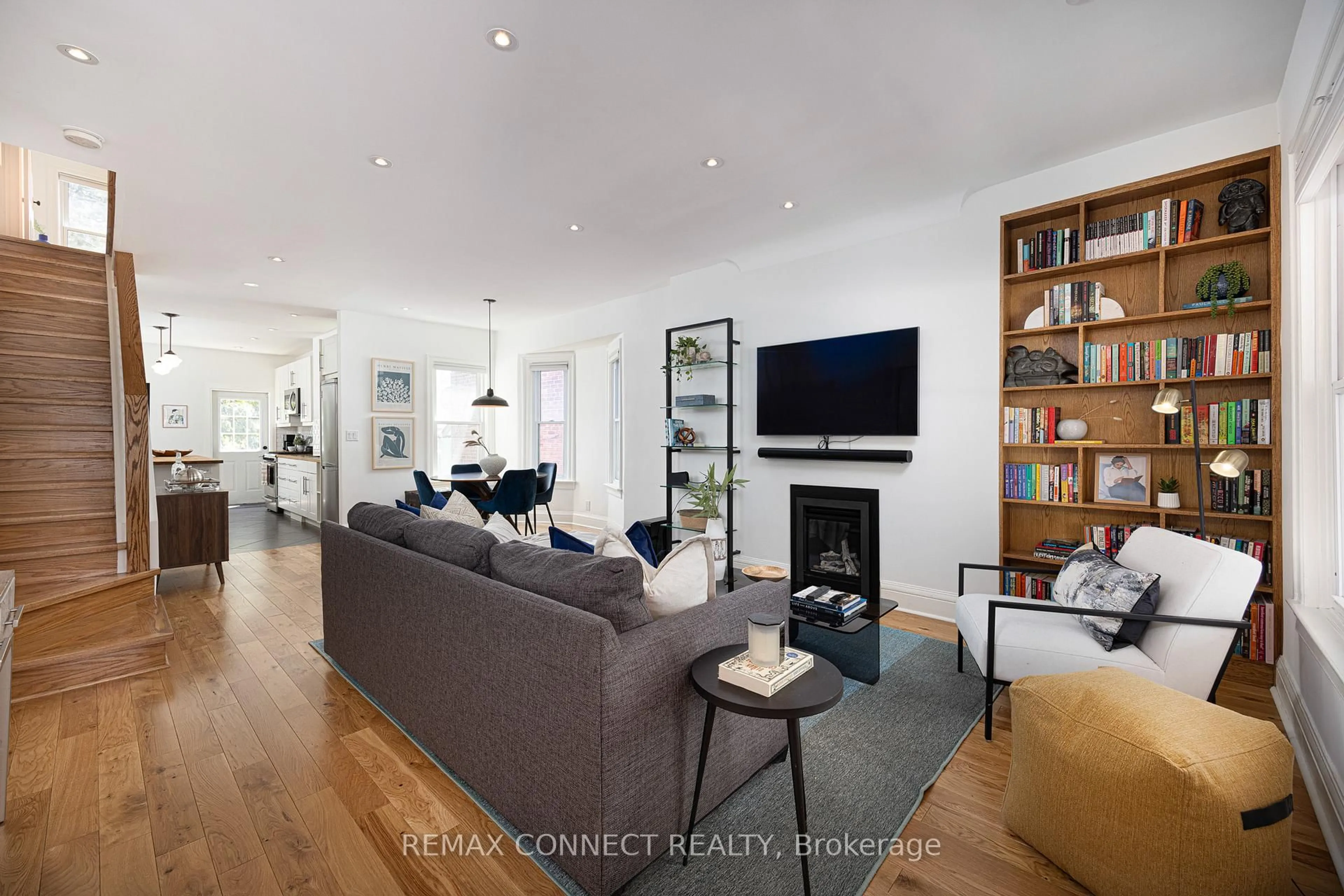 Living room with furniture, wood/laminate floor for 29 Howard Park Ave, Toronto Ontario M6R 1V3