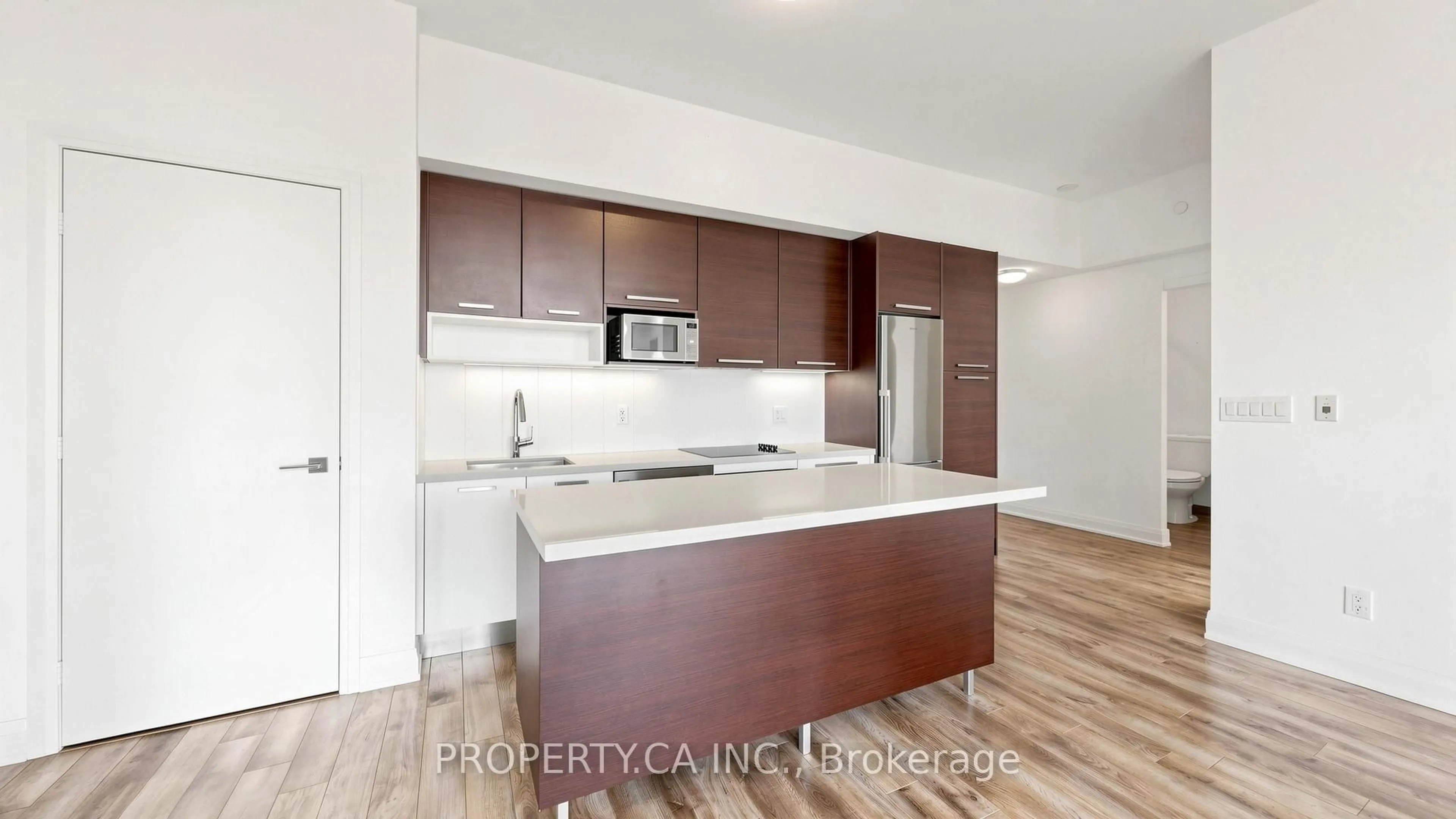 Open concept kitchen, wood/laminate floor for 36 Park Lawn Rd #2203, Toronto Ontario M8V 0E5