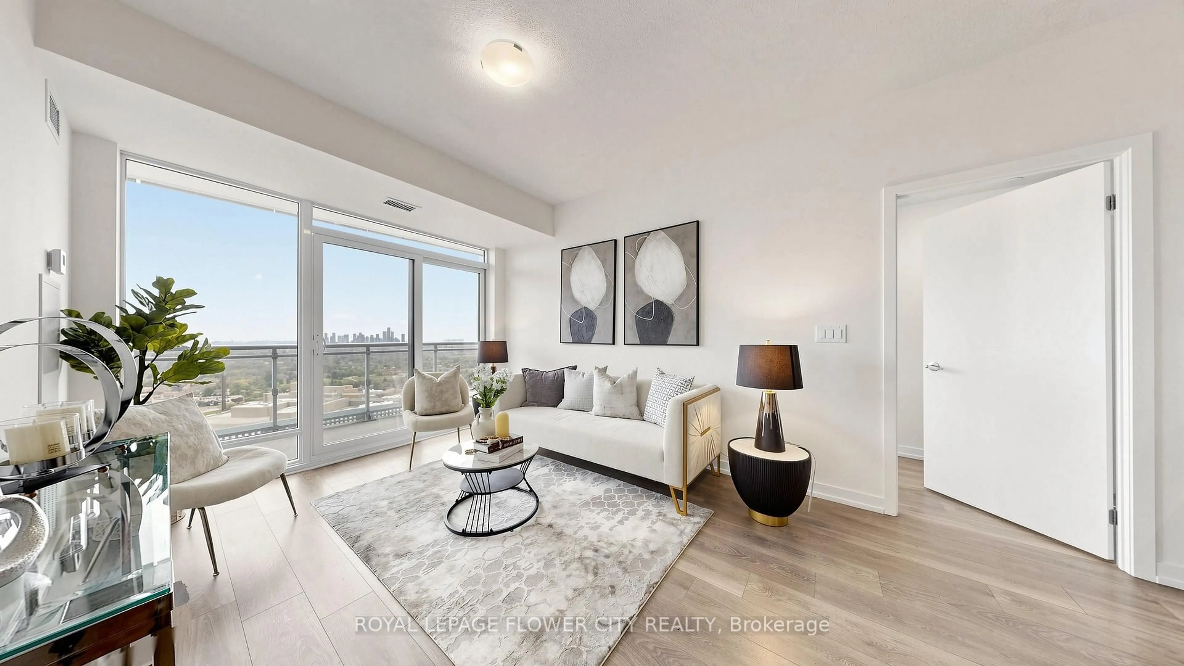 Living room with furniture, wood/laminate floor for 2520 Eglinton Ave #1710, Mississauga Ontario L5M 0Y4