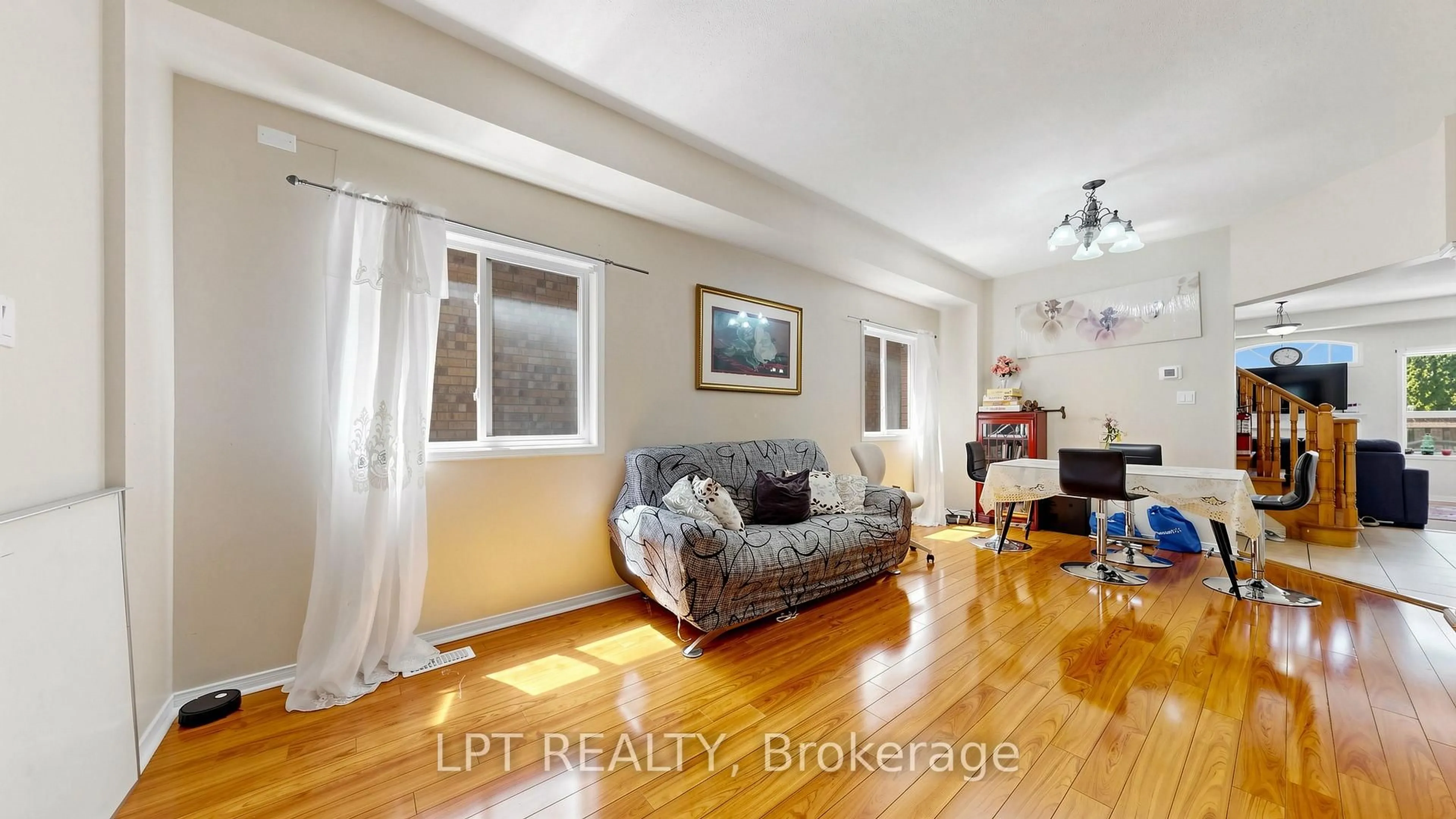 Living room with furniture, wood/laminate floor for 30 RANCHERO Dr, Brampton Ontario L7A 3C6