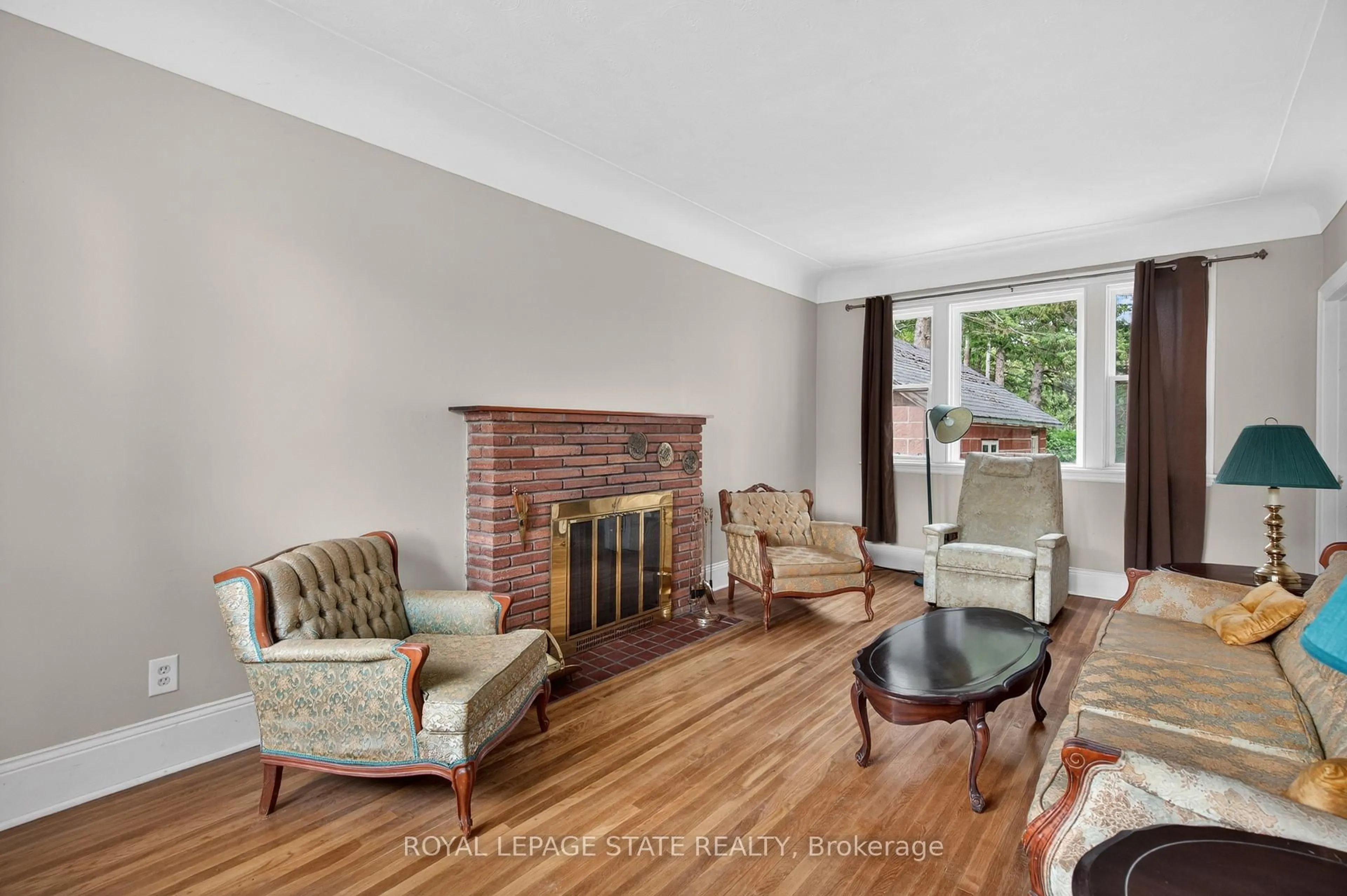 Living room with furniture, wood/laminate floor for 893 Lasalle Park Rd, Burlington Ontario L7T 1M6
