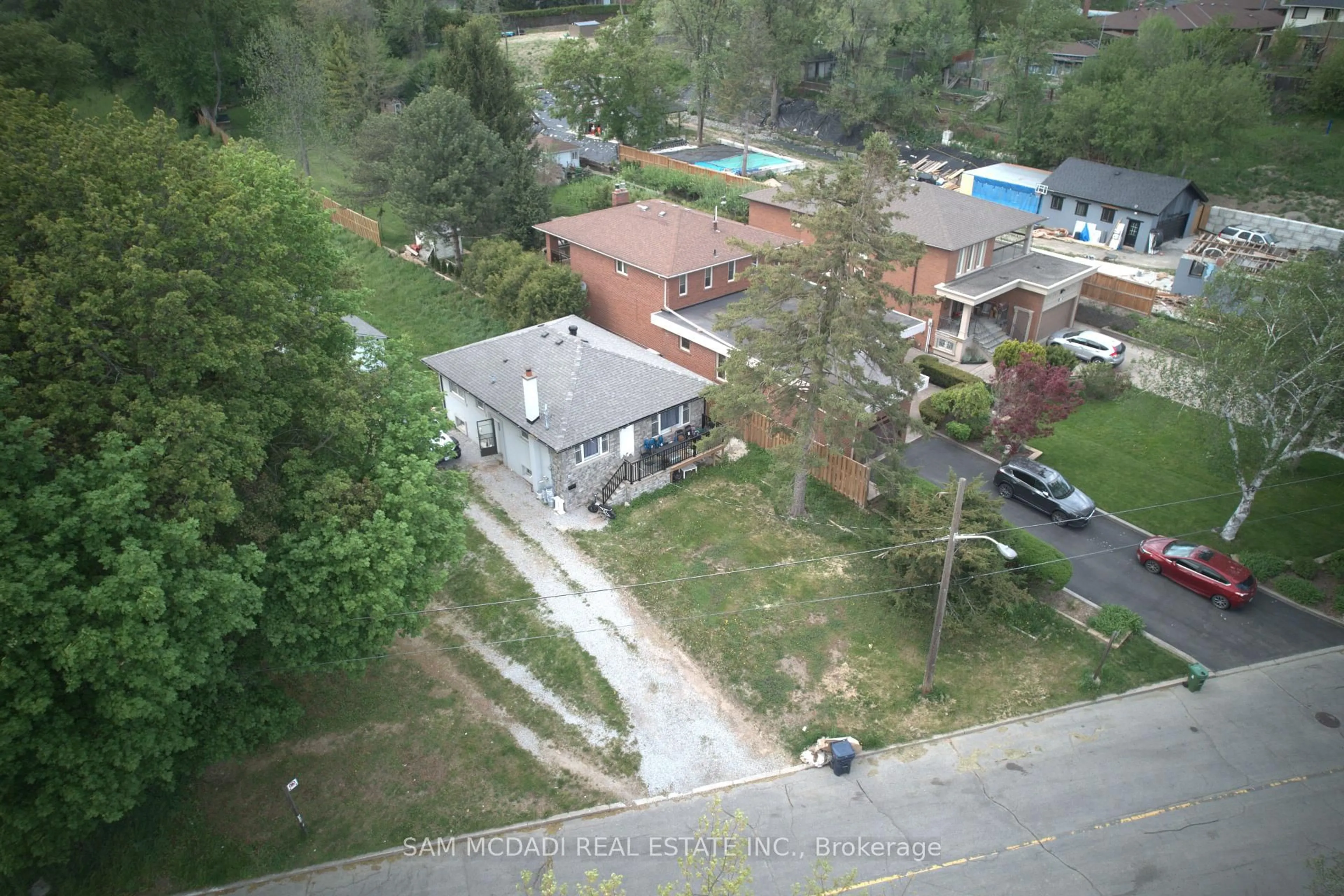 A pic from outside/outdoor area/front of a property/back of a property/a pic from drone, street for 148 Rowntree Mill Rd #Road, Toronto Ontario M9L 1C9