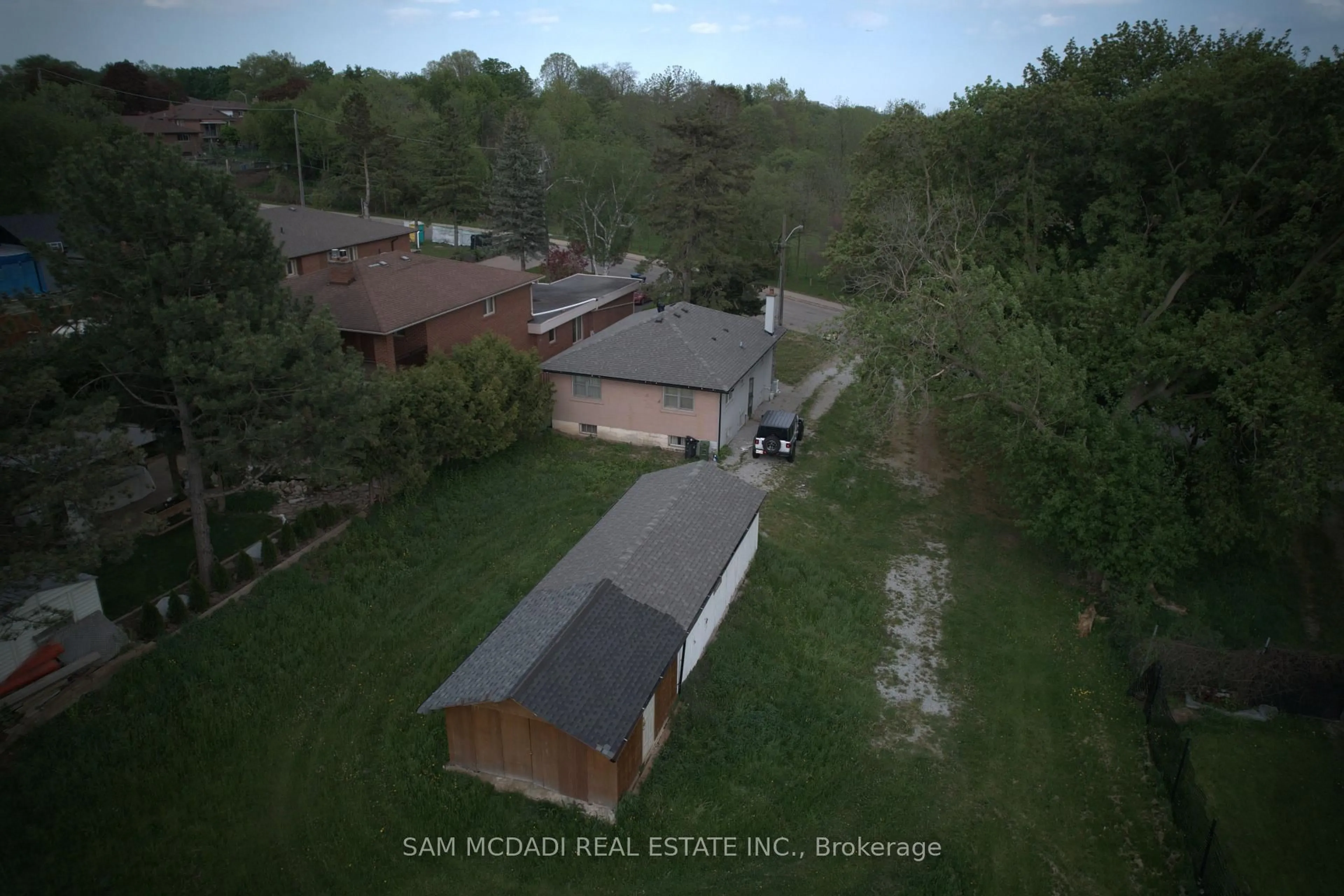 A pic from outside/outdoor area/front of a property/back of a property/a pic from drone, street for 148 Rowntree Mill Rd #Road, Toronto Ontario M9L 1C9