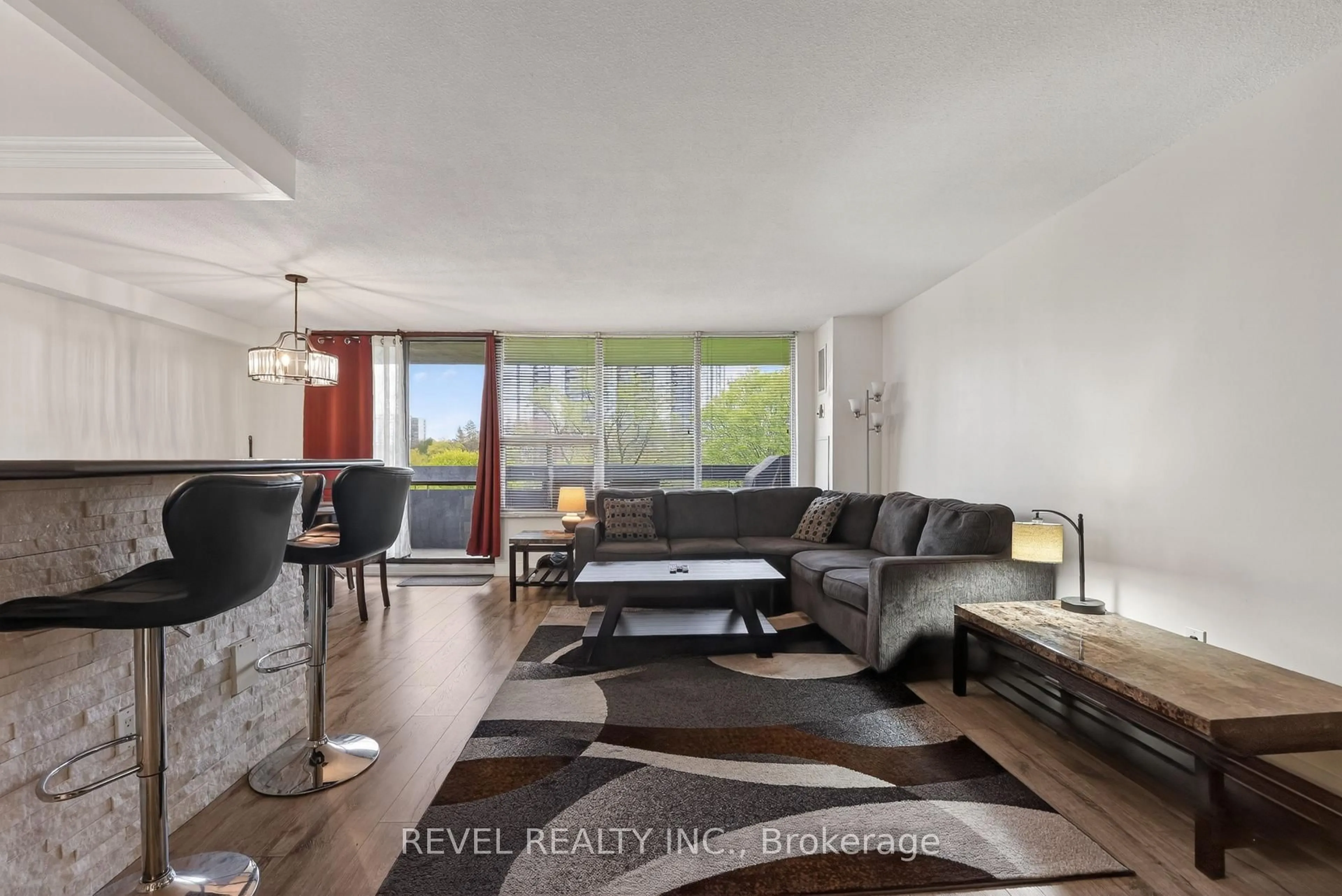 Living room with furniture, unknown for 11 Wincott Dr #403, Toronto Ontario M9R 2R9
