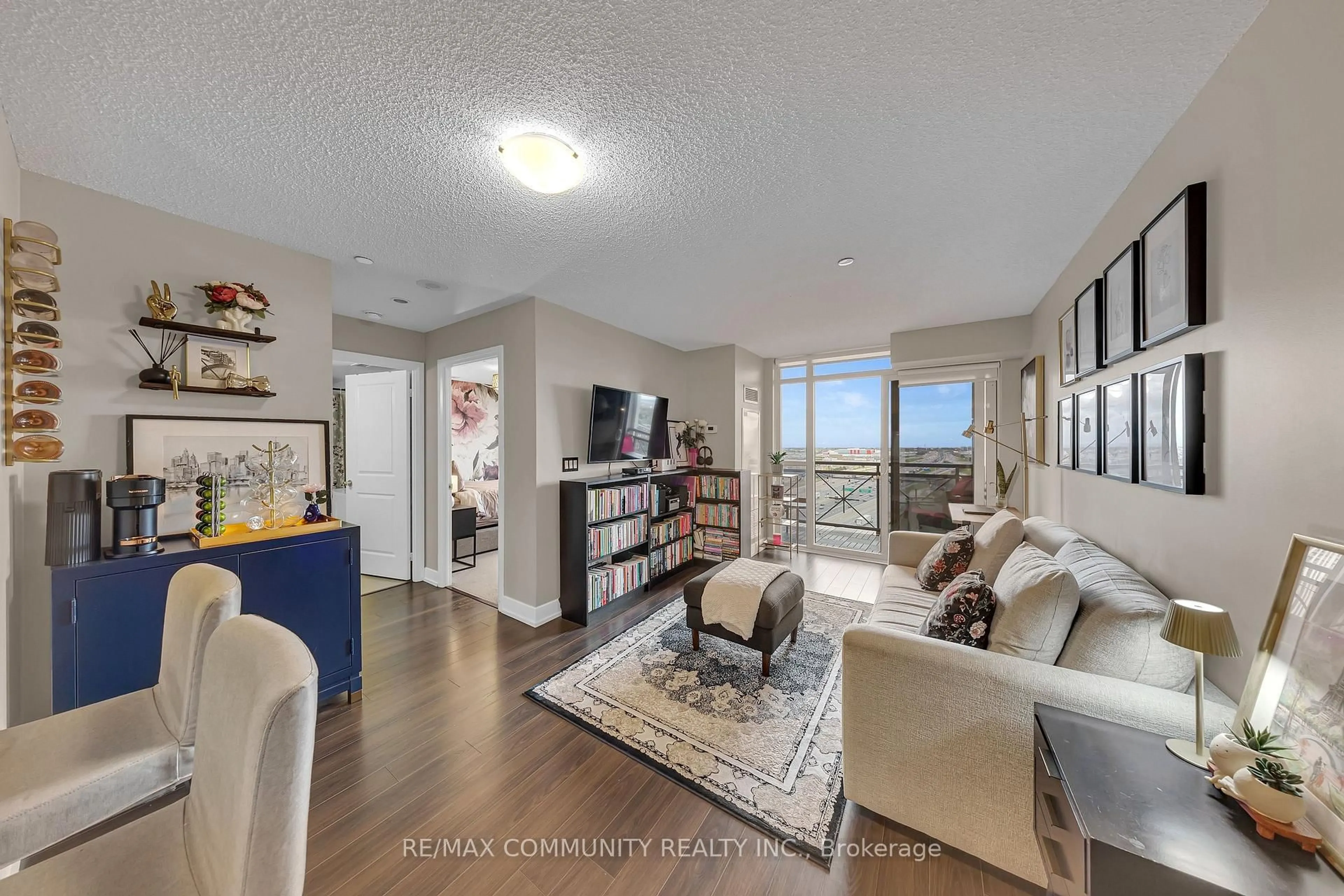 Living room with furniture, unknown for 2 Eva Rd #1227, Toronto Ontario M9C 0A9