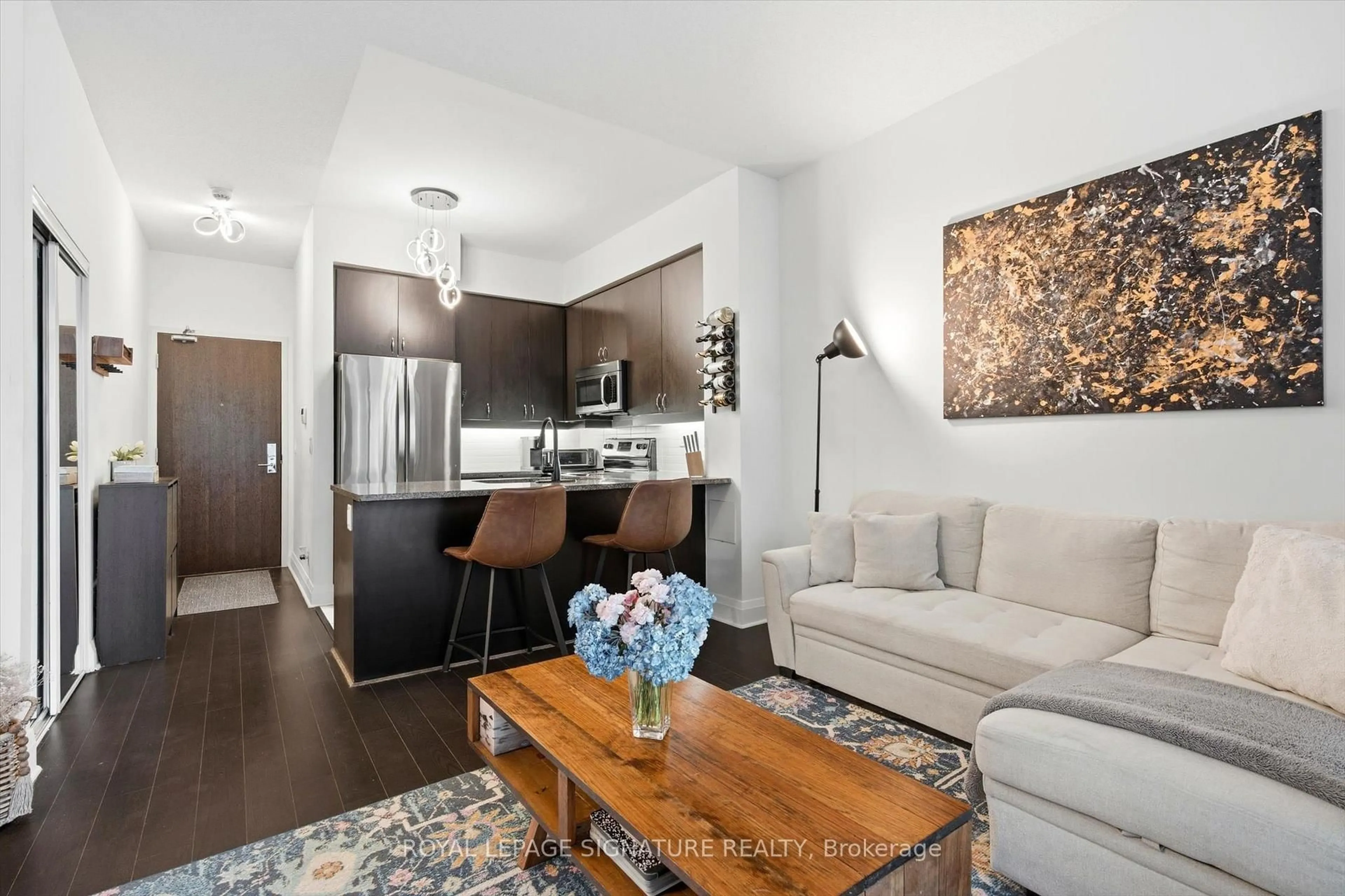 Living room with furniture, wood/laminate floor for 1185 The Queensway #527, Toronto Ontario M8Z 0C6