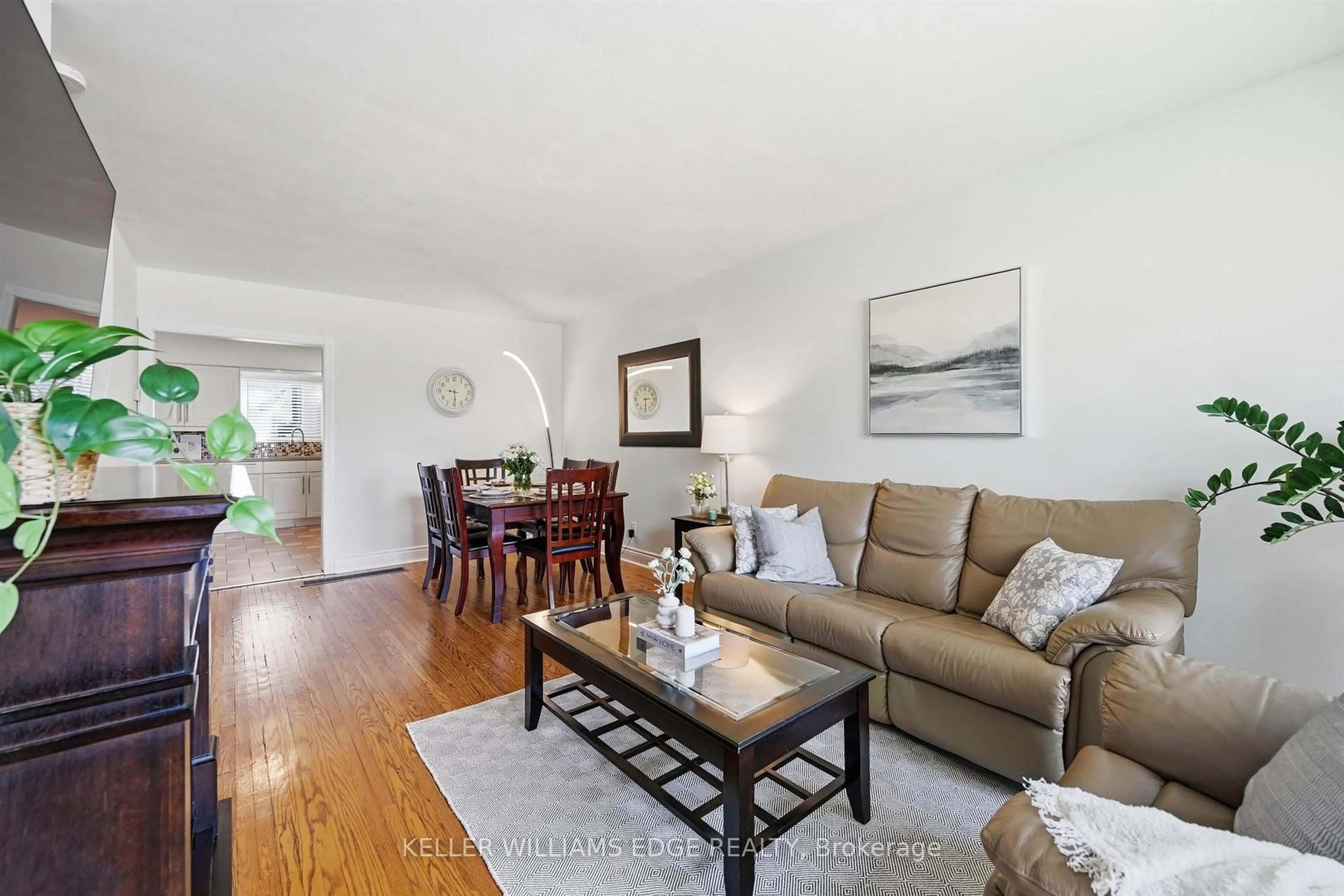 Living room with furniture, wood/laminate floor for 2441 Barclay Rd, Burlington Ontario L7R 2B7