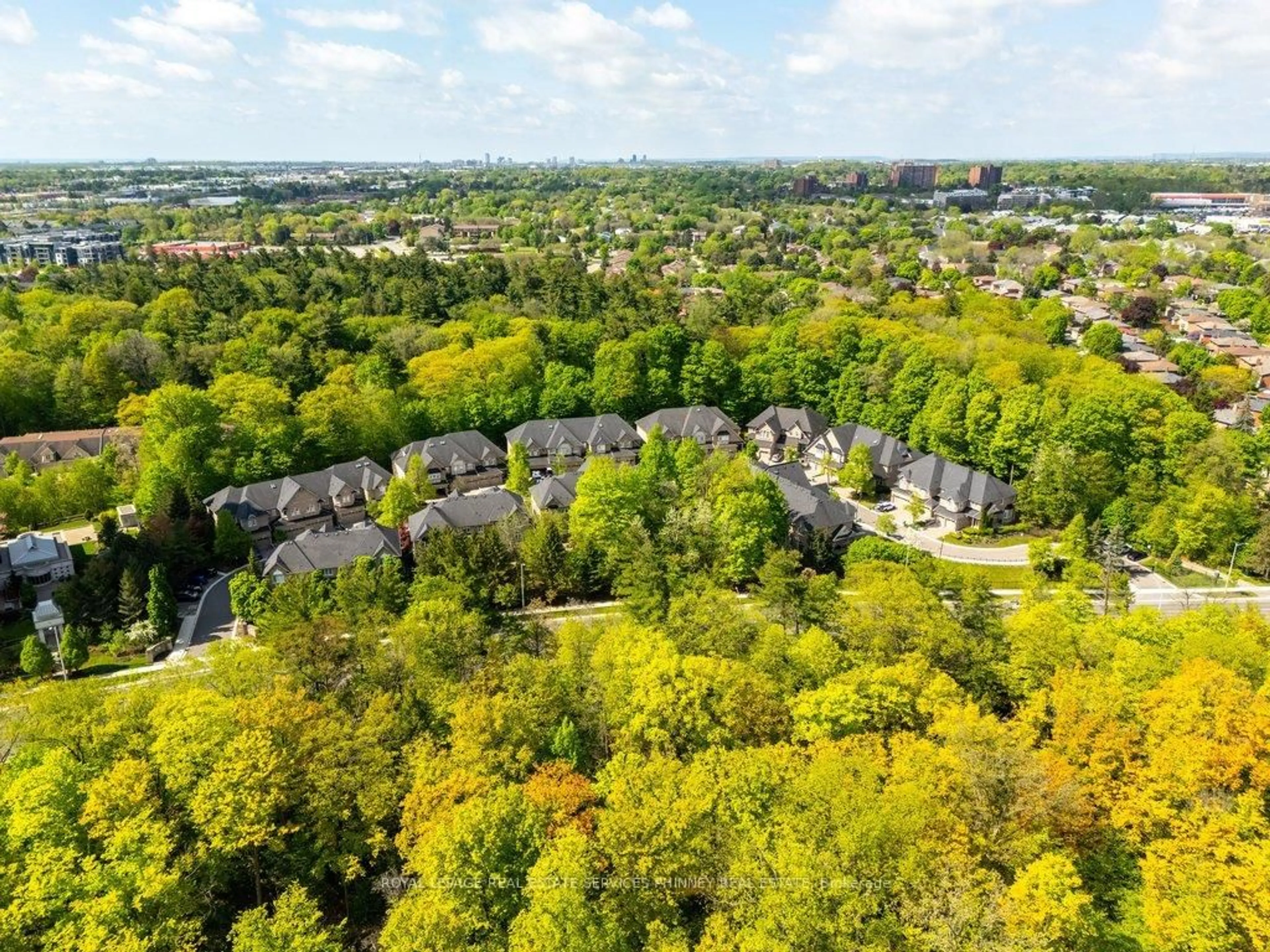 A pic from outside/outdoor area/front of a property/back of a property/a pic from drone, forest/trees view for 2000 The Collegeway Way #35, Mississauga Ontario L5L 5Y9