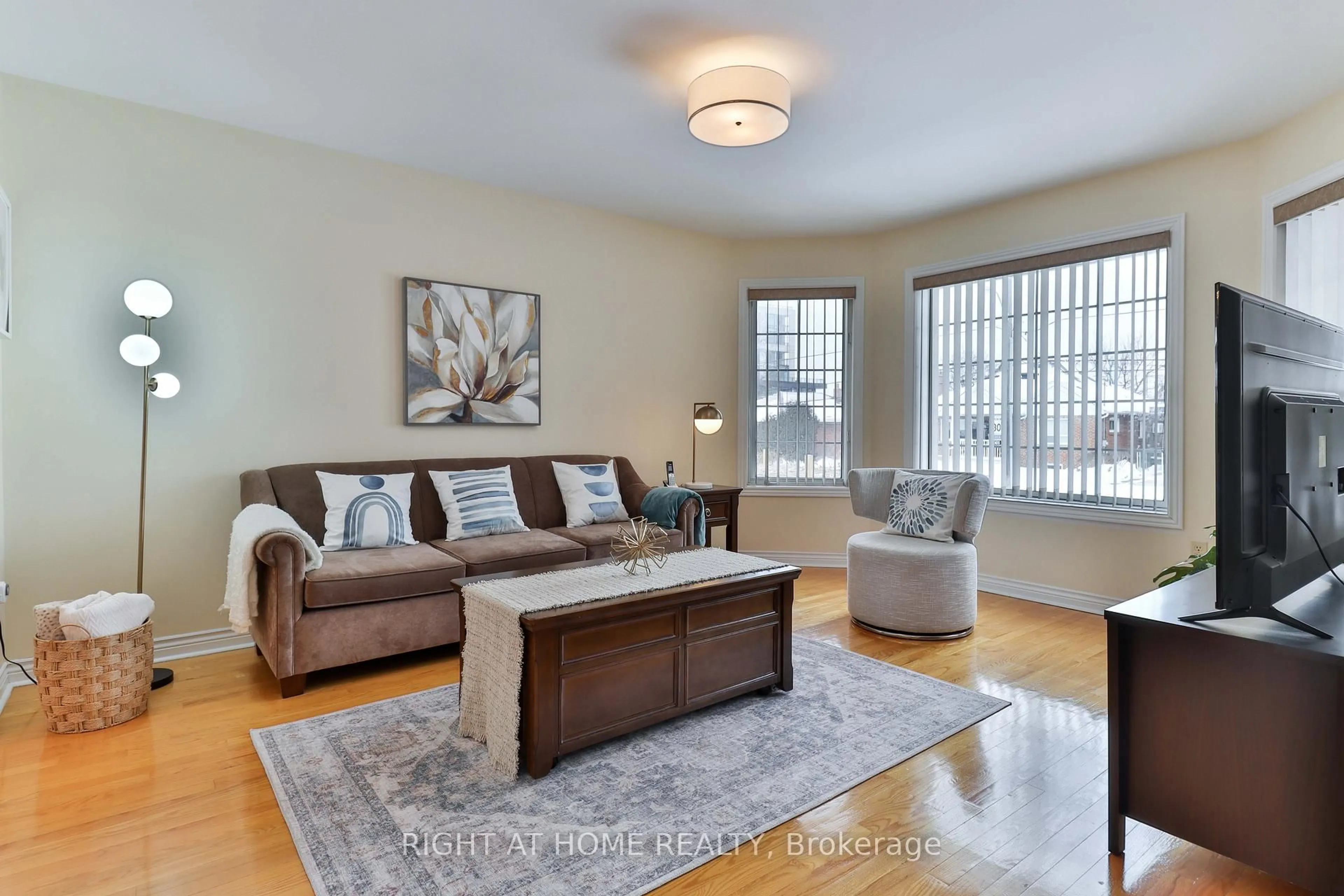 Living room with furniture, wood/laminate floor for 459 Maple Leaf Dr, Toronto Ontario M6L 1R1