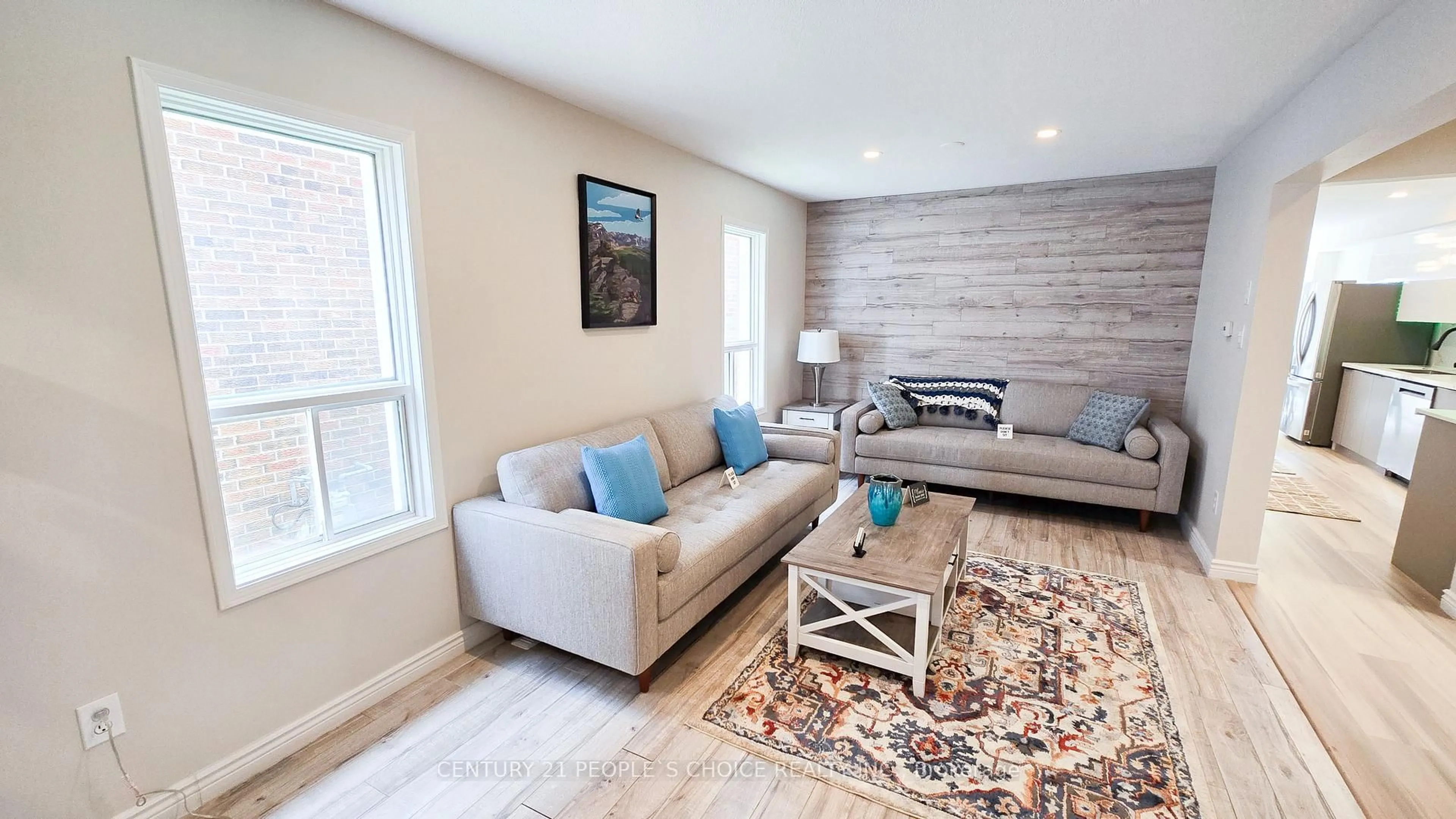 Living room with furniture, wood/laminate floor for 340 Perry Rd, Orangeville Ontario L9W 4Z1