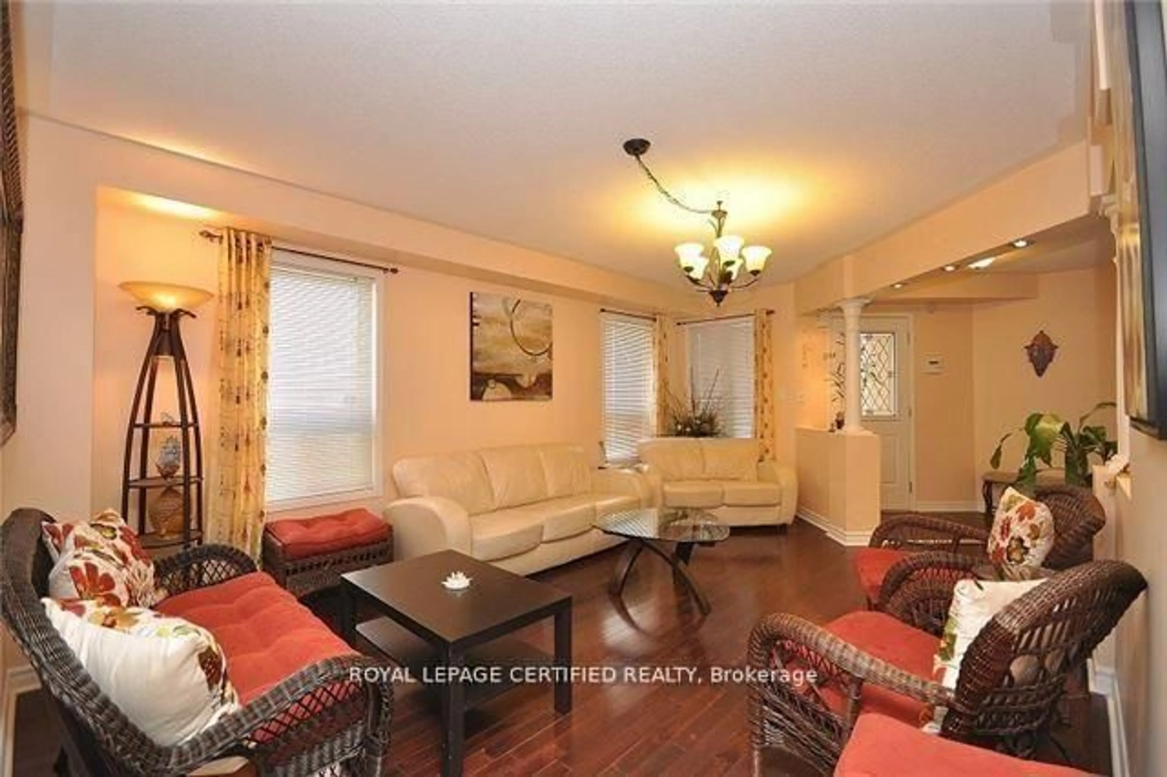 Living room with furniture, wood/laminate floor for 426 Orange Walk Cres, Mississauga Ontario L5R 0A8