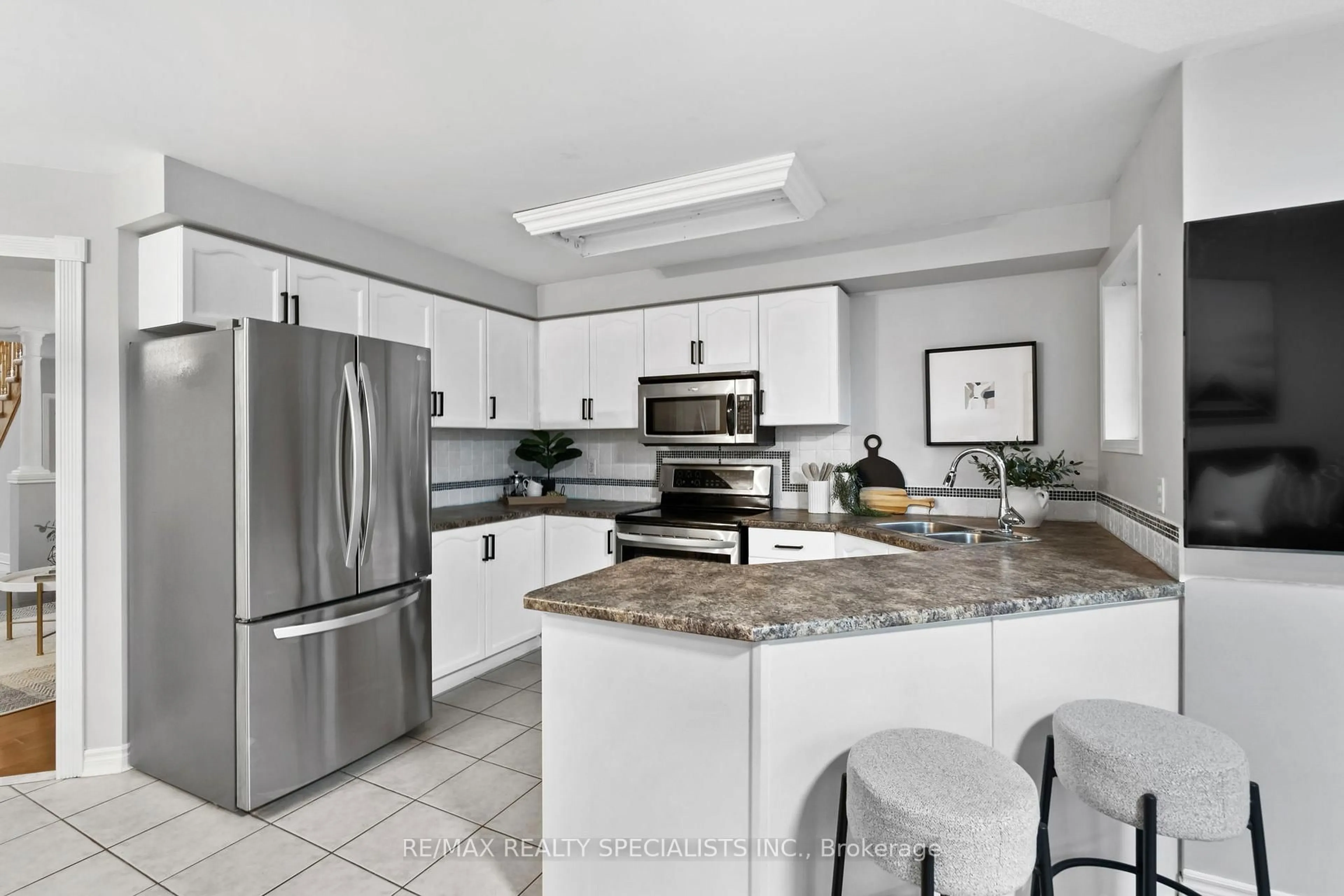 Open concept kitchen, ceramic/tile floor for 175 Manley Lane, Milton Ontario L9T 5P1