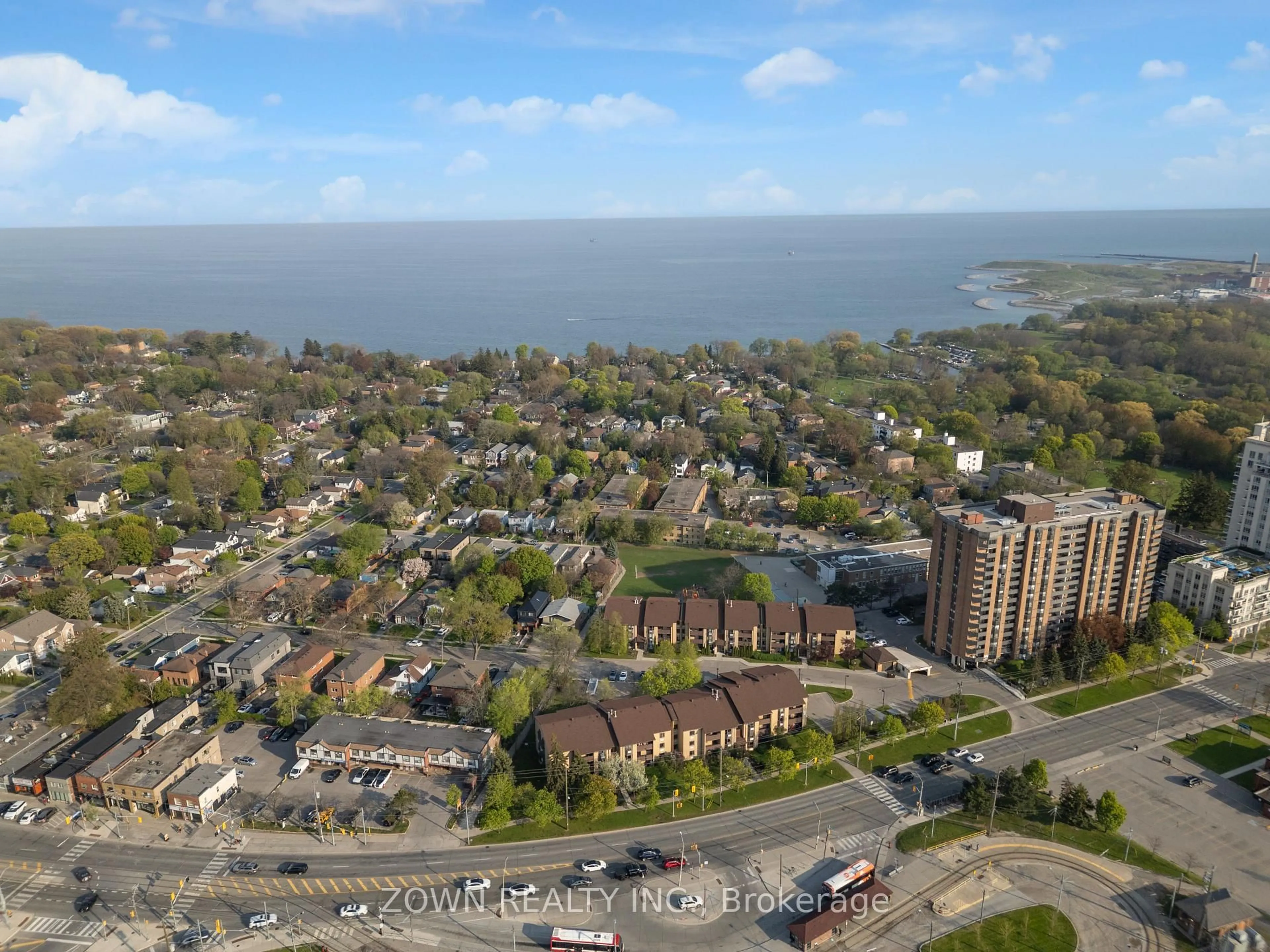 A pic from outside/outdoor area/front of a property/back of a property/a pic from drone, water/lake/river/ocean view for 3835 Lakeshore Blvd #210, Toronto Ontario M8W 1R2