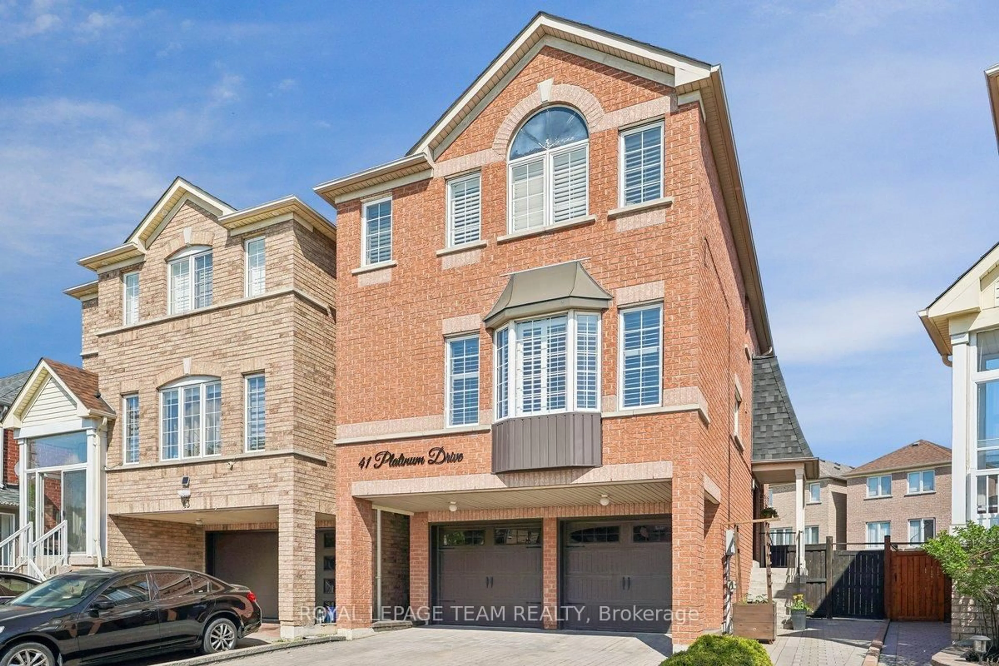 Home with brick exterior material, street for 41 Platinum Dr, Toronto Ontario M6M 5K2