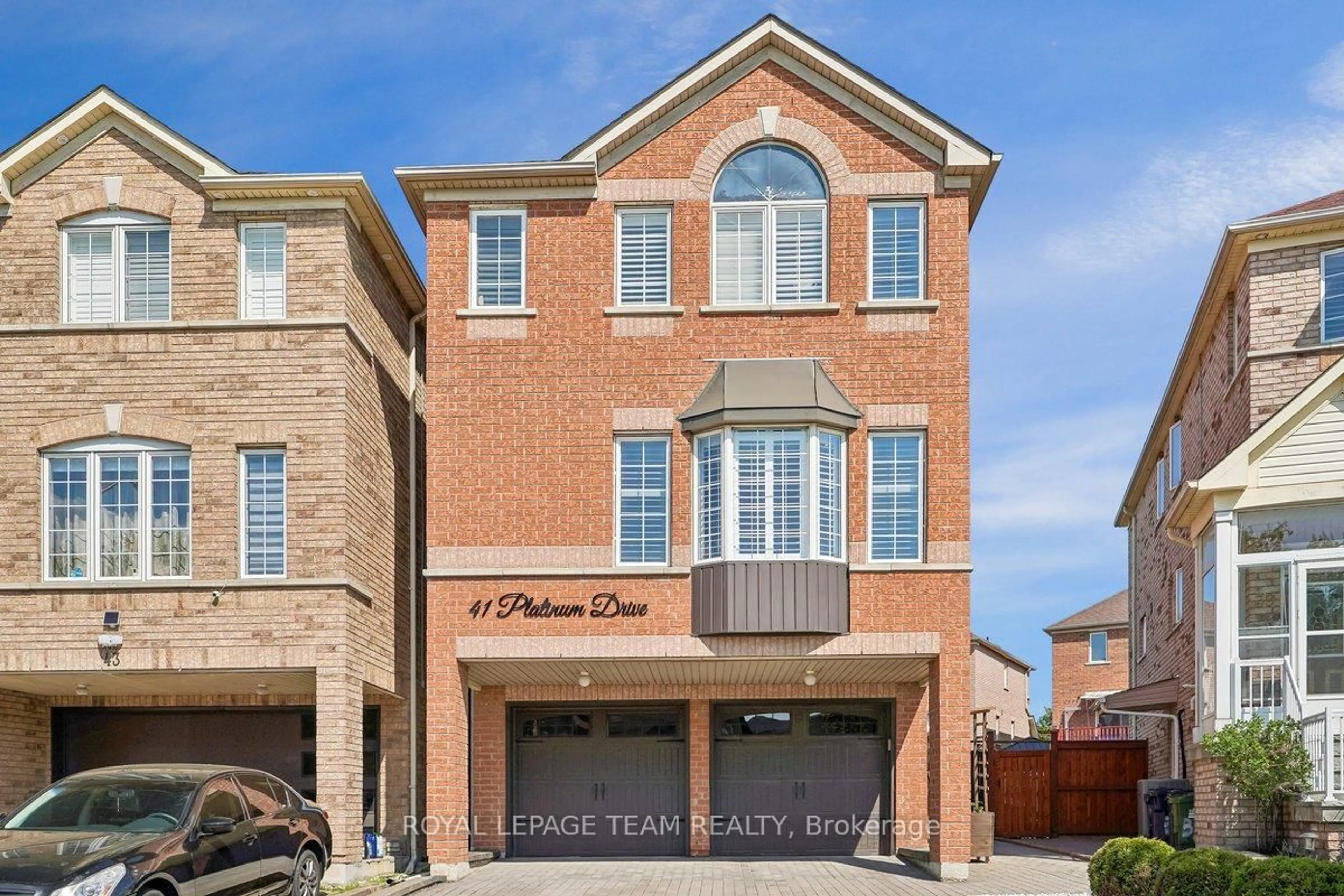 Home with brick exterior material, street for 41 Platinum Dr, Toronto Ontario M6M 5K2
