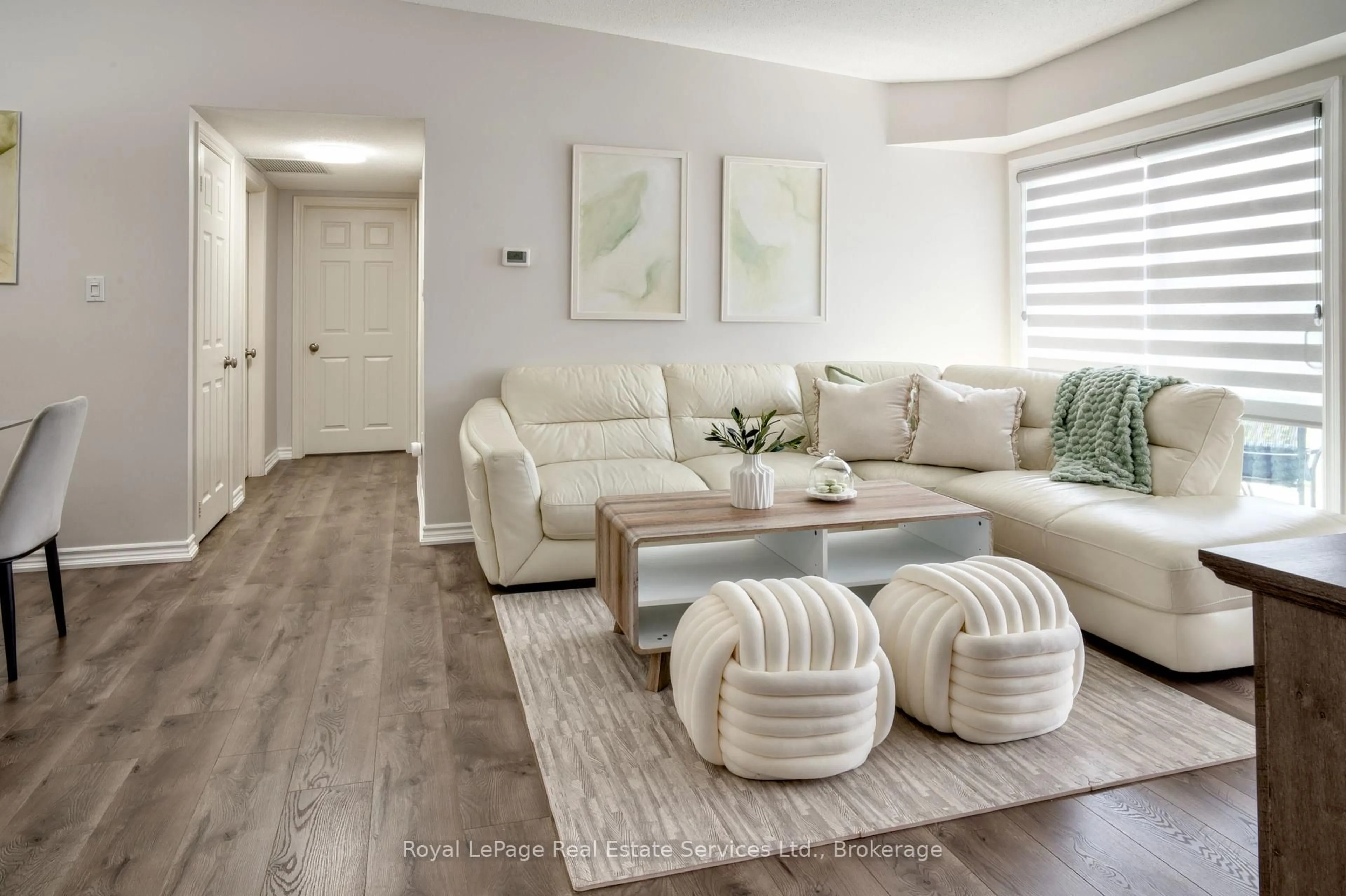 Living room with furniture, wood/laminate floor for 1701 Lampman Ave #507, Burlington Ontario L7L 6R9