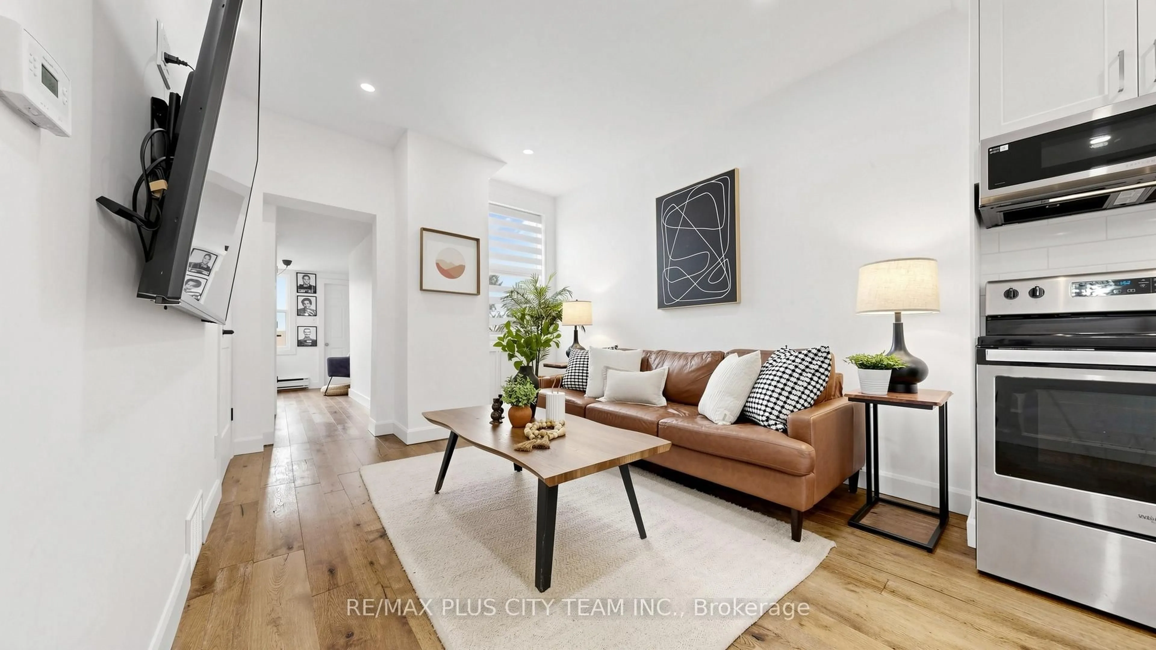 Living room with furniture, wood/laminate floor for 320 Boon Ave, Toronto Ontario M6E 4A5