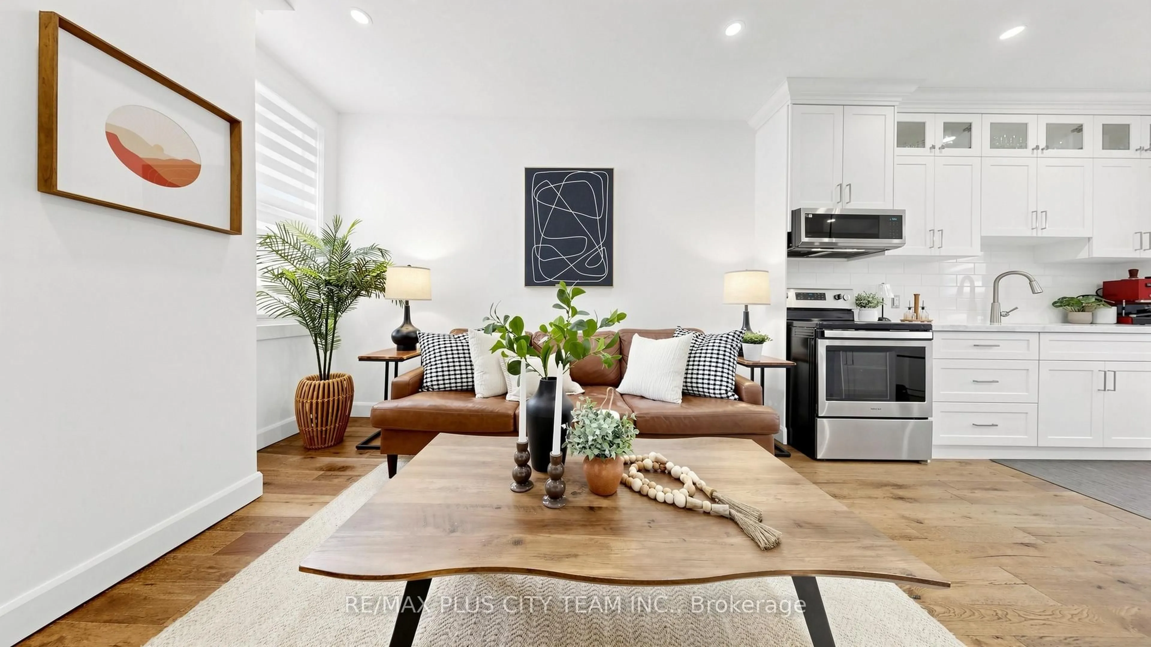 Living room with furniture, wood/laminate floor for 320 Boon Ave, Toronto Ontario M6E 4A5