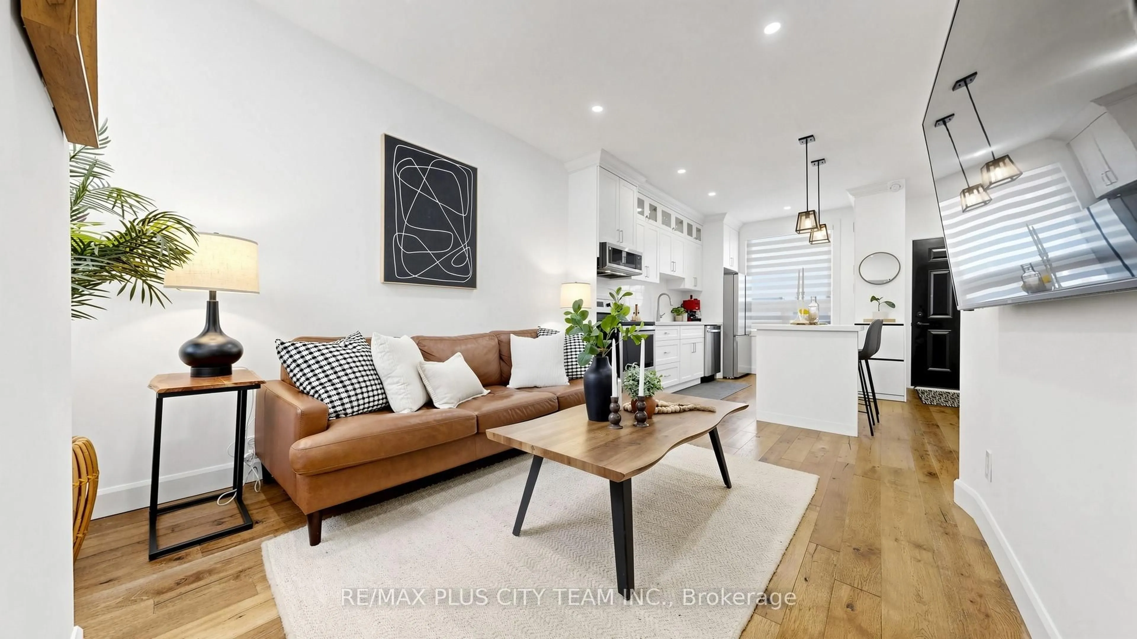 Living room with furniture, wood/laminate floor for 320 Boon Ave, Toronto Ontario M6E 4A5
