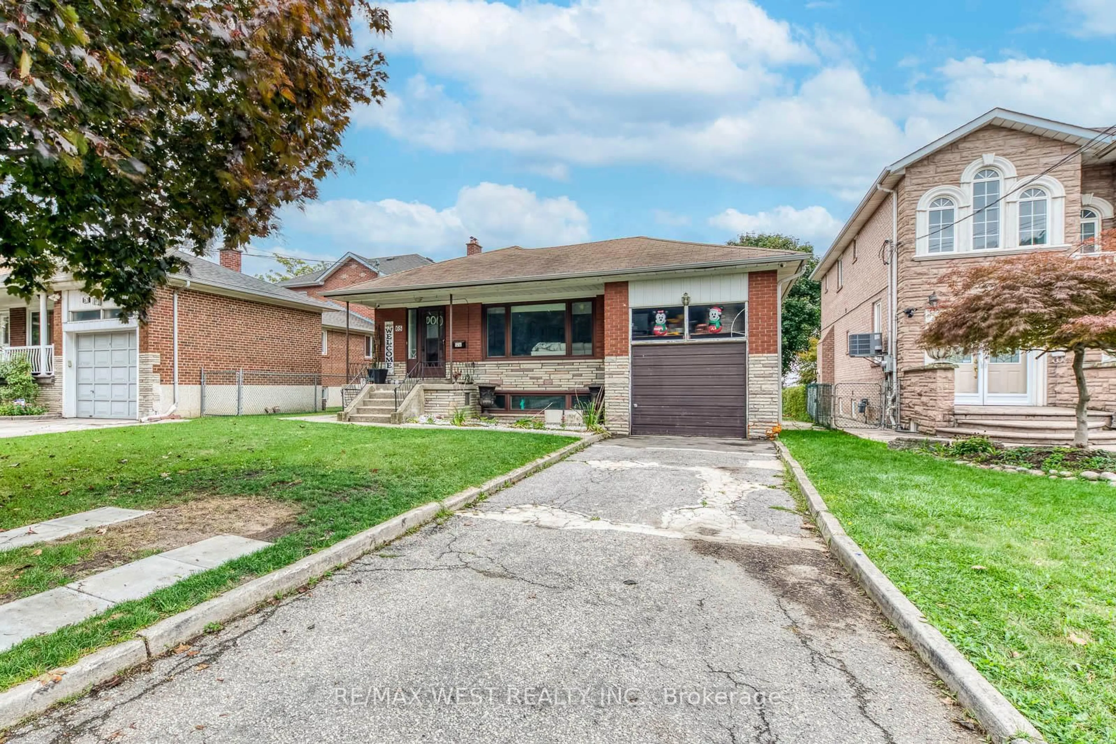 Home with brick exterior material, street for 65 North Park Dr, Toronto Ontario M6L 1K4