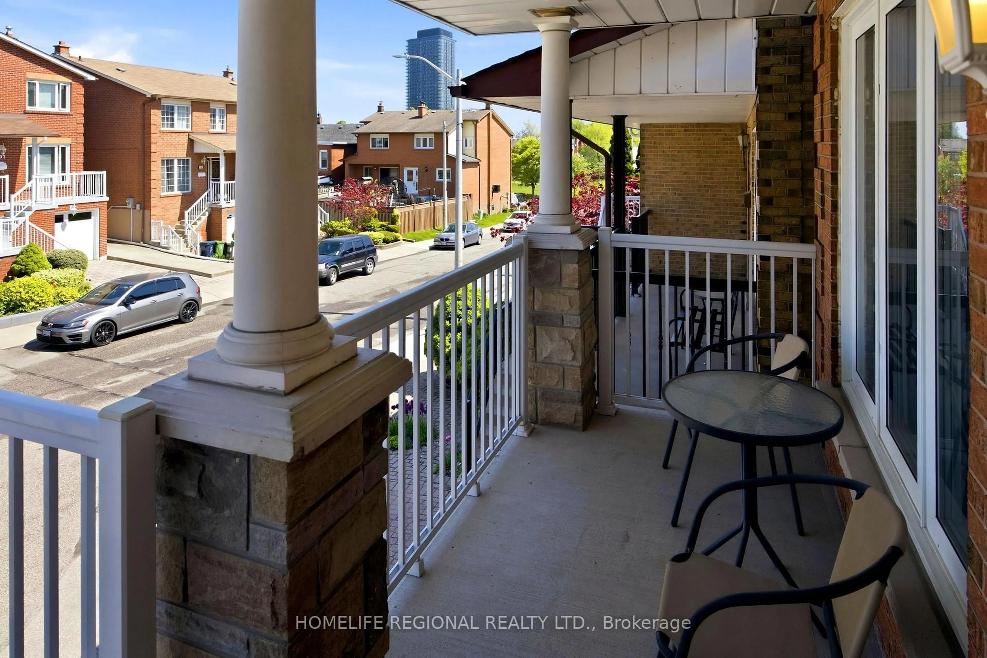 Patio, city buildings view from balcony for 122 Beaver Terr, Toronto Ontario M6H 4G8