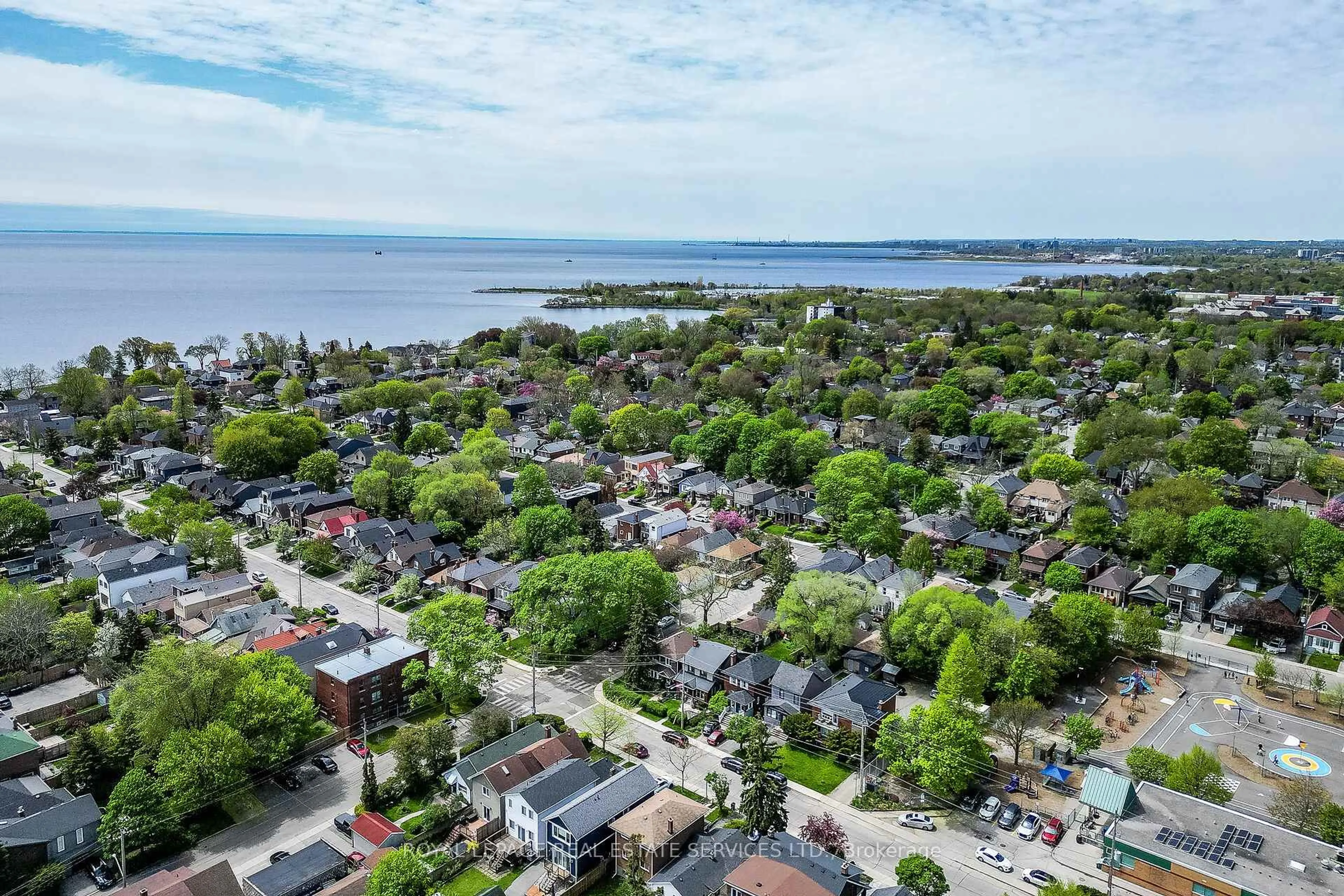 A pic from outside/outdoor area/front of a property/back of a property/a pic from drone, water/lake/river/ocean view for 74 Sixth St, Toronto Ontario M8V 3A3