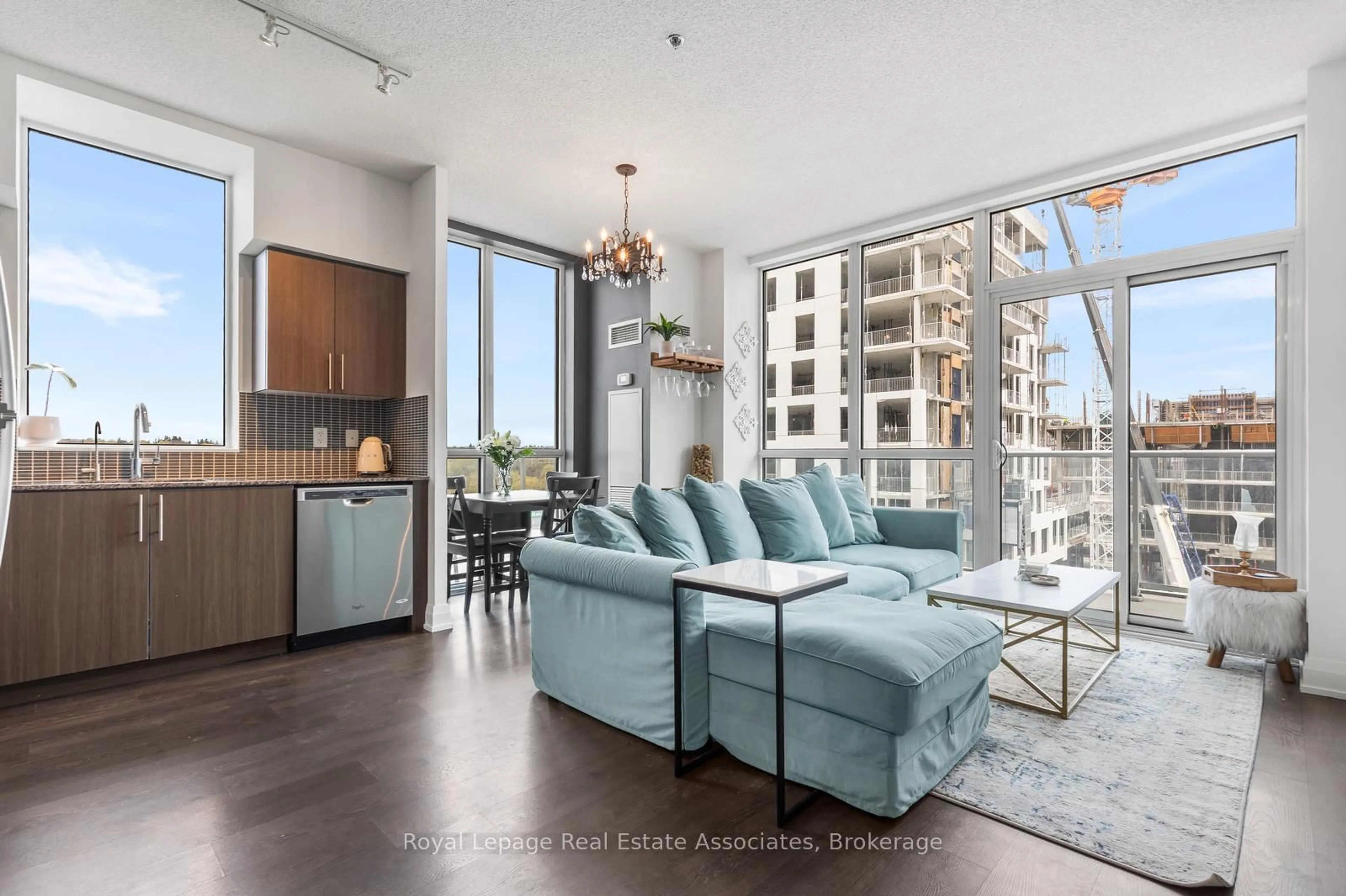 Living room with furniture, unknown for 65 Speers Rd #503, Oakville Ontario L6K 0J1