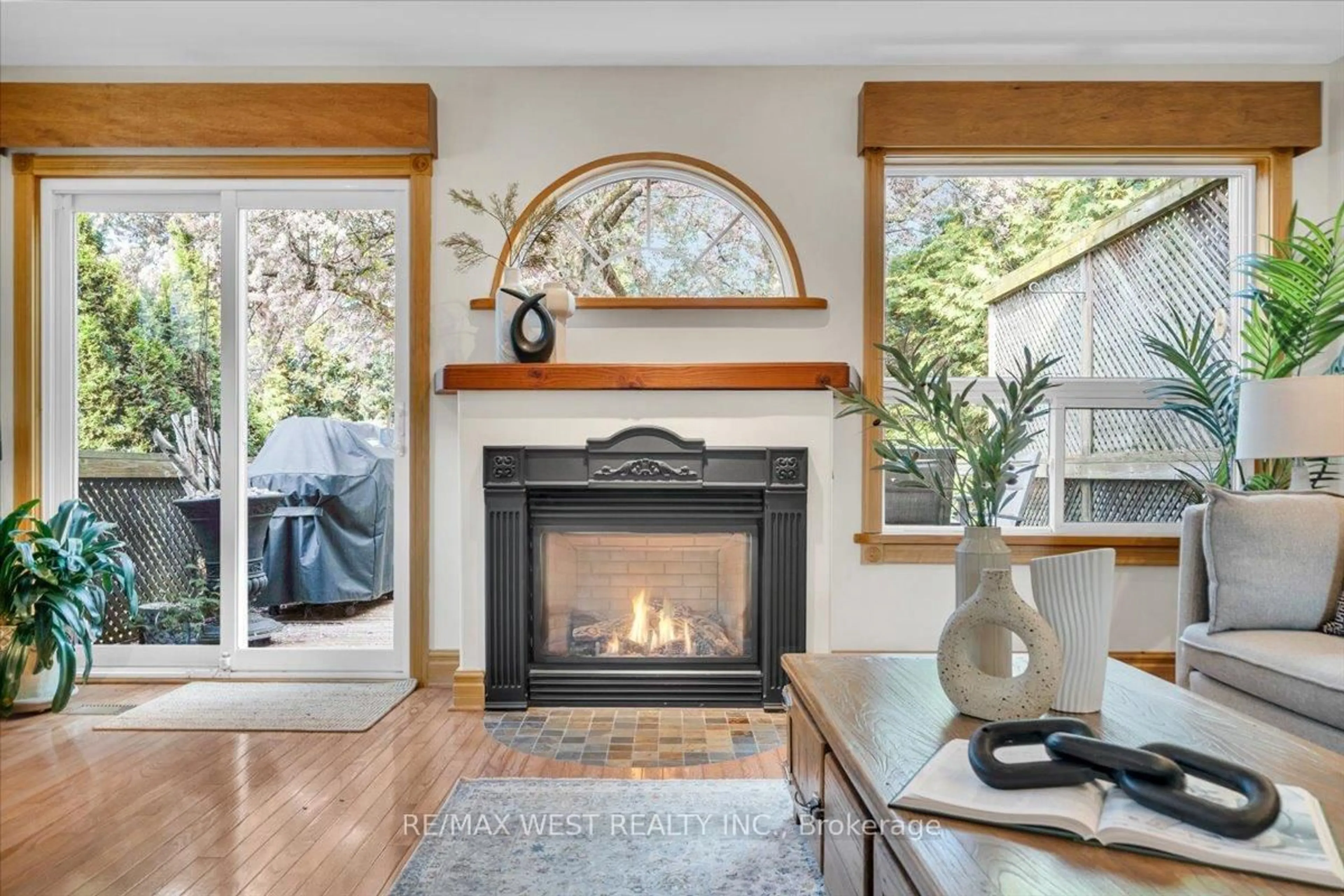 Living room with furniture, wood/laminate floor for 35 Gort Ave, Toronto Ontario M8W 3Y7
