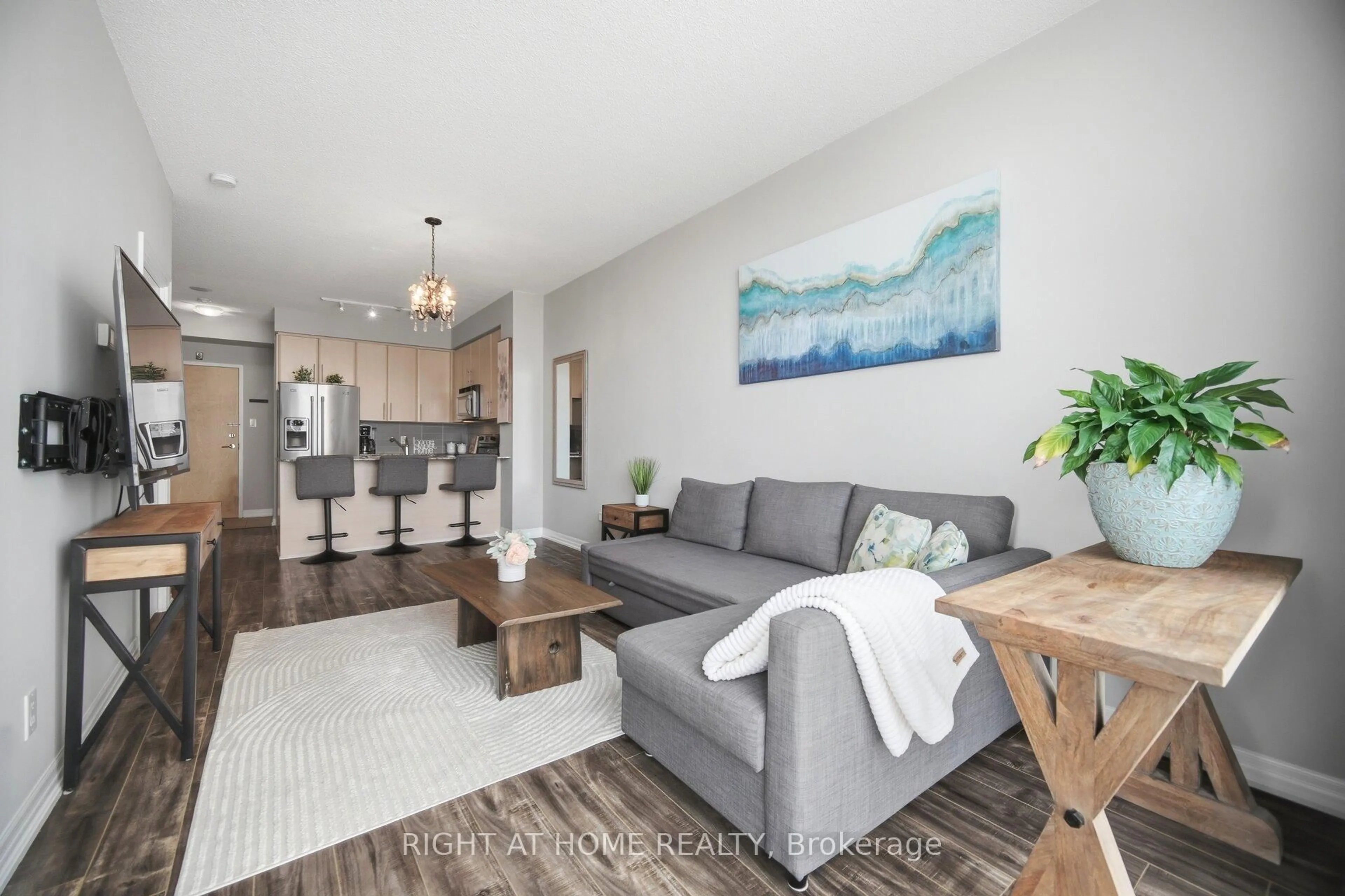 Living room with furniture, wood/laminate floor for 3515 Kariya Dr #803, Mississauga Ontario L5B 0C1