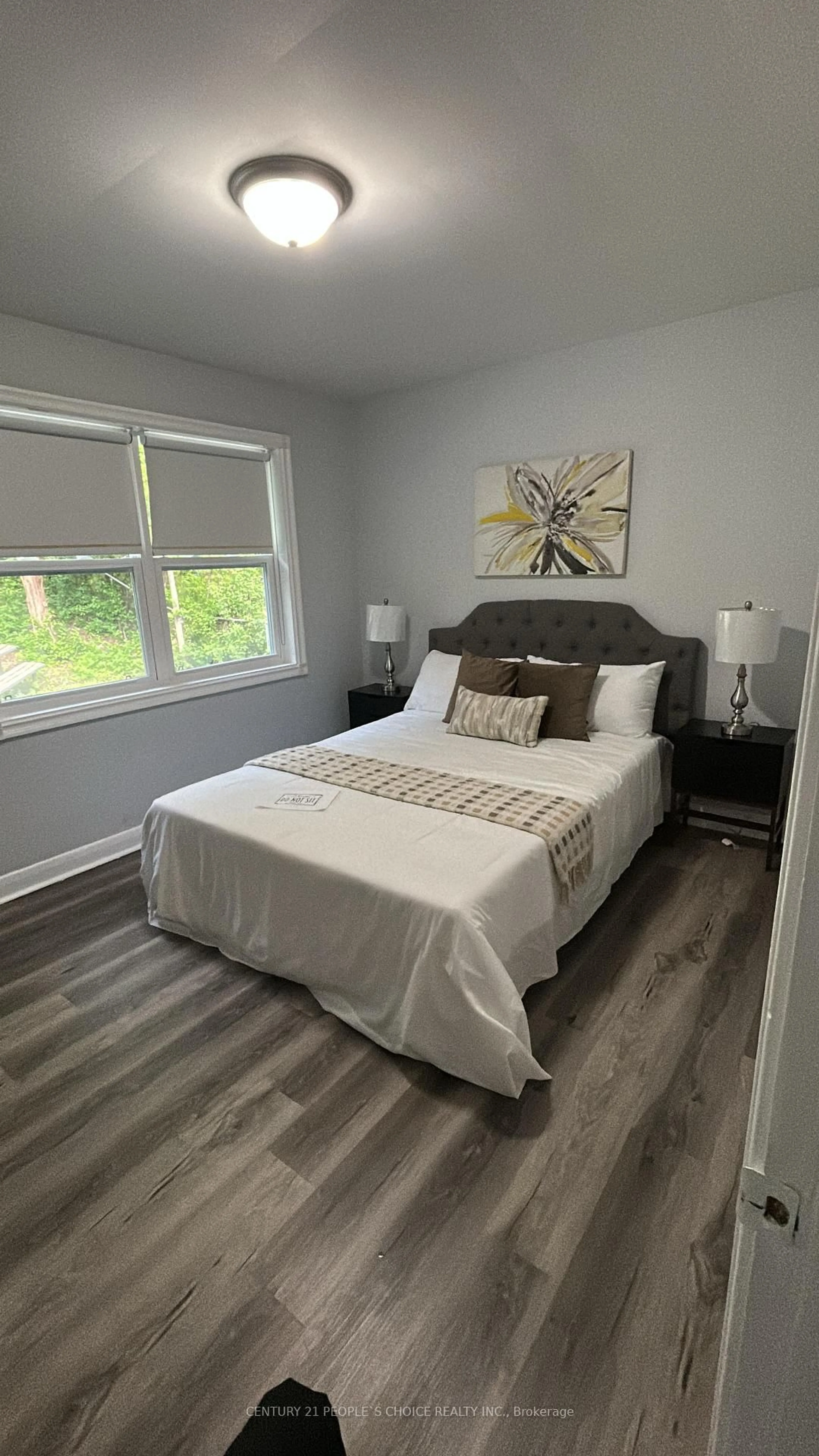 Bedroom with bed, wood/laminate floor for 39 Meadowland Dr, Brampton Ontario L6W 2R5