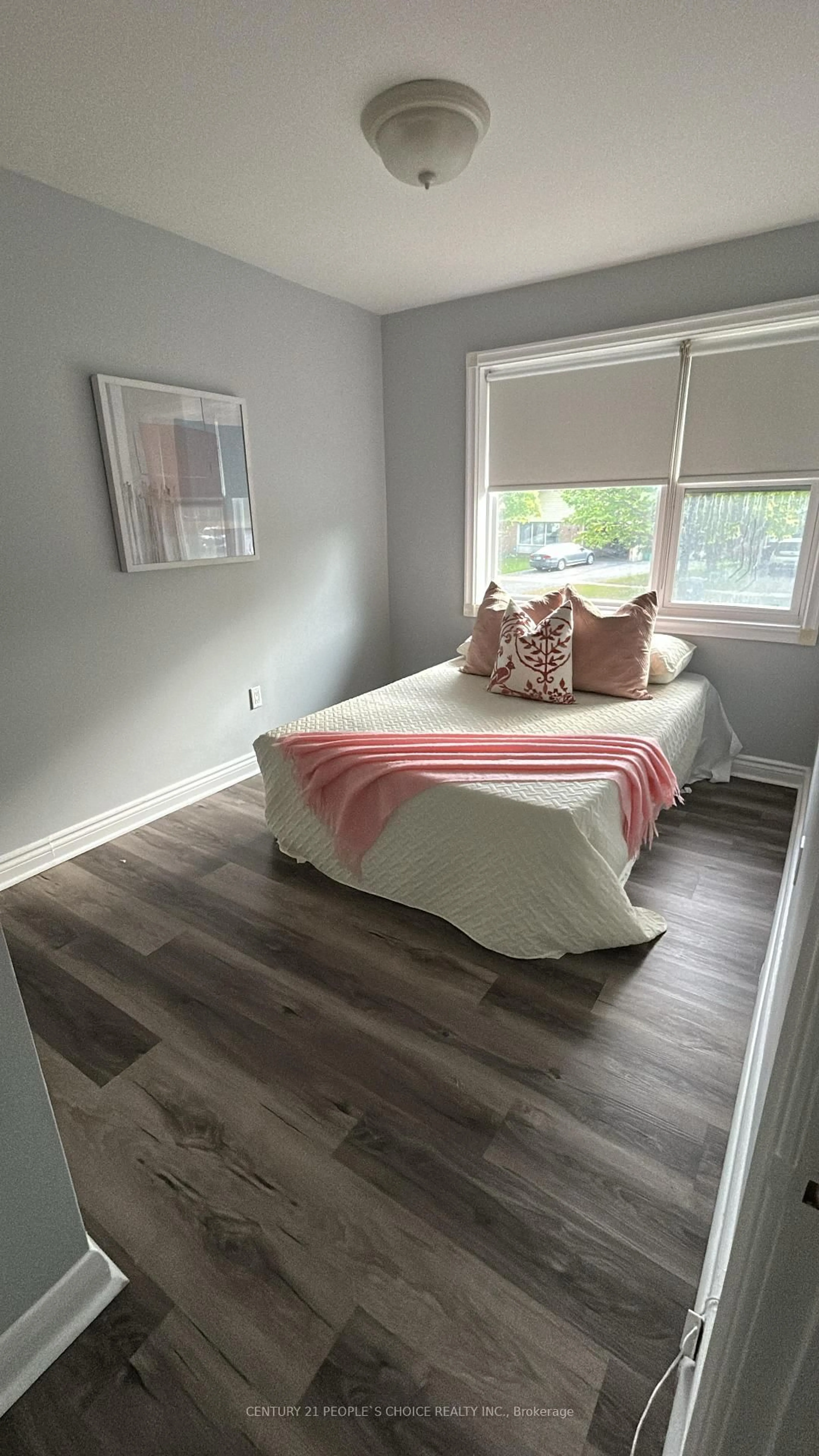 Bedroom with bed, wood/laminate floor for 39 Meadowland Dr, Brampton Ontario L6W 2R5