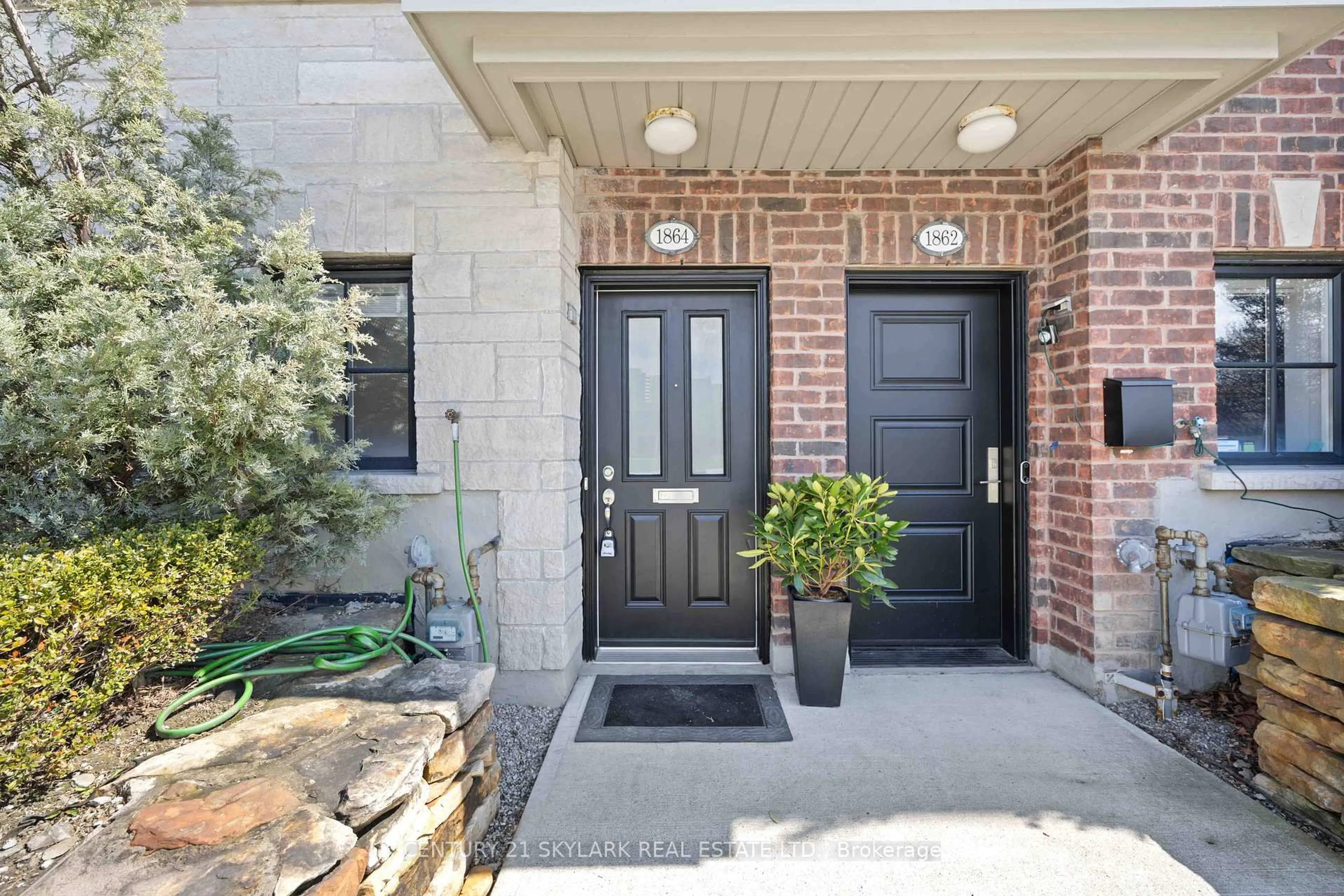 Home with brick exterior material, street for 1864 Burnhamthorpe Rd, Mississauga Ontario L4X 2S5