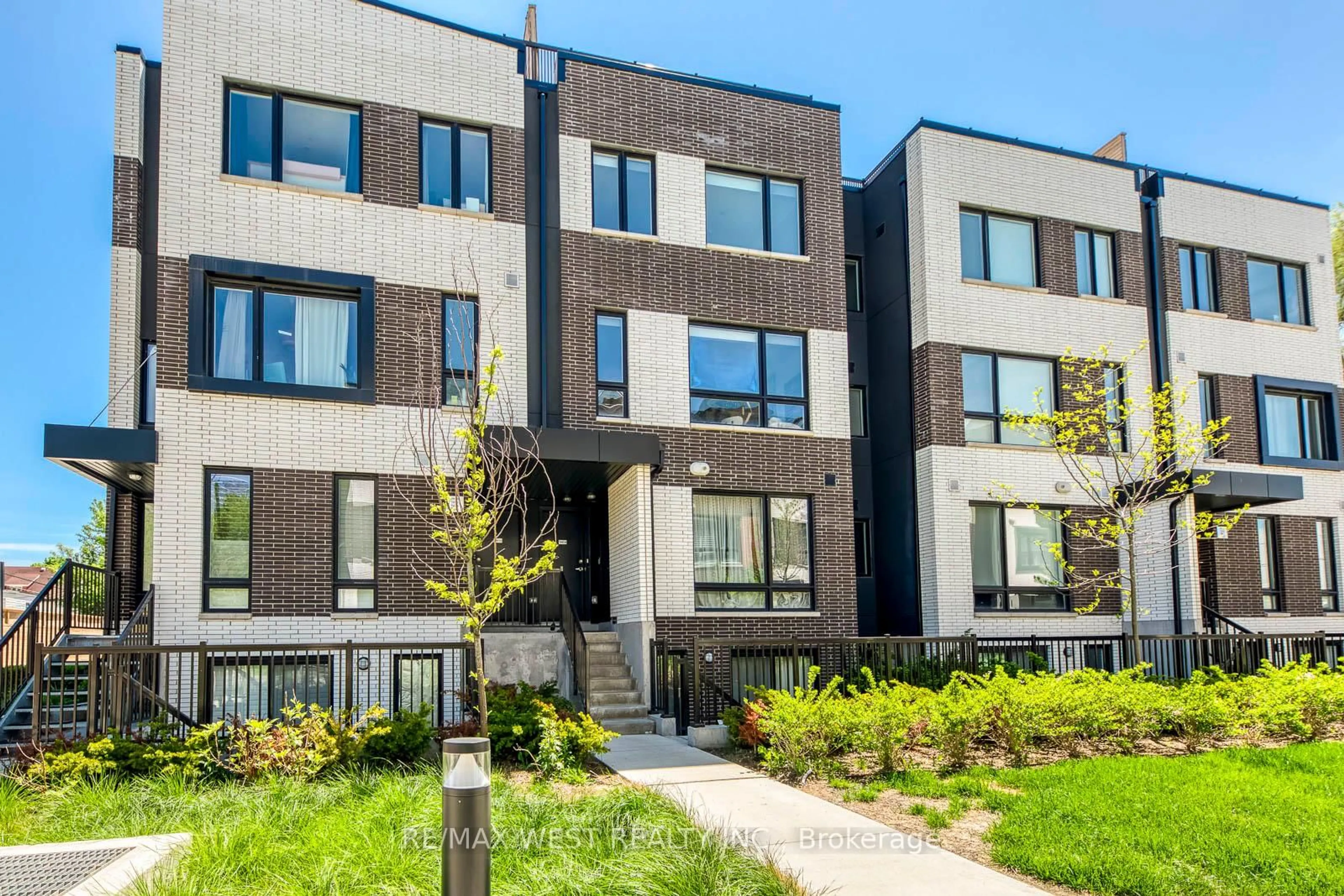 Home with brick exterior material, street for 30 Ed Clark Gardens Blvd #14, Toronto Ontario M6N 0B5