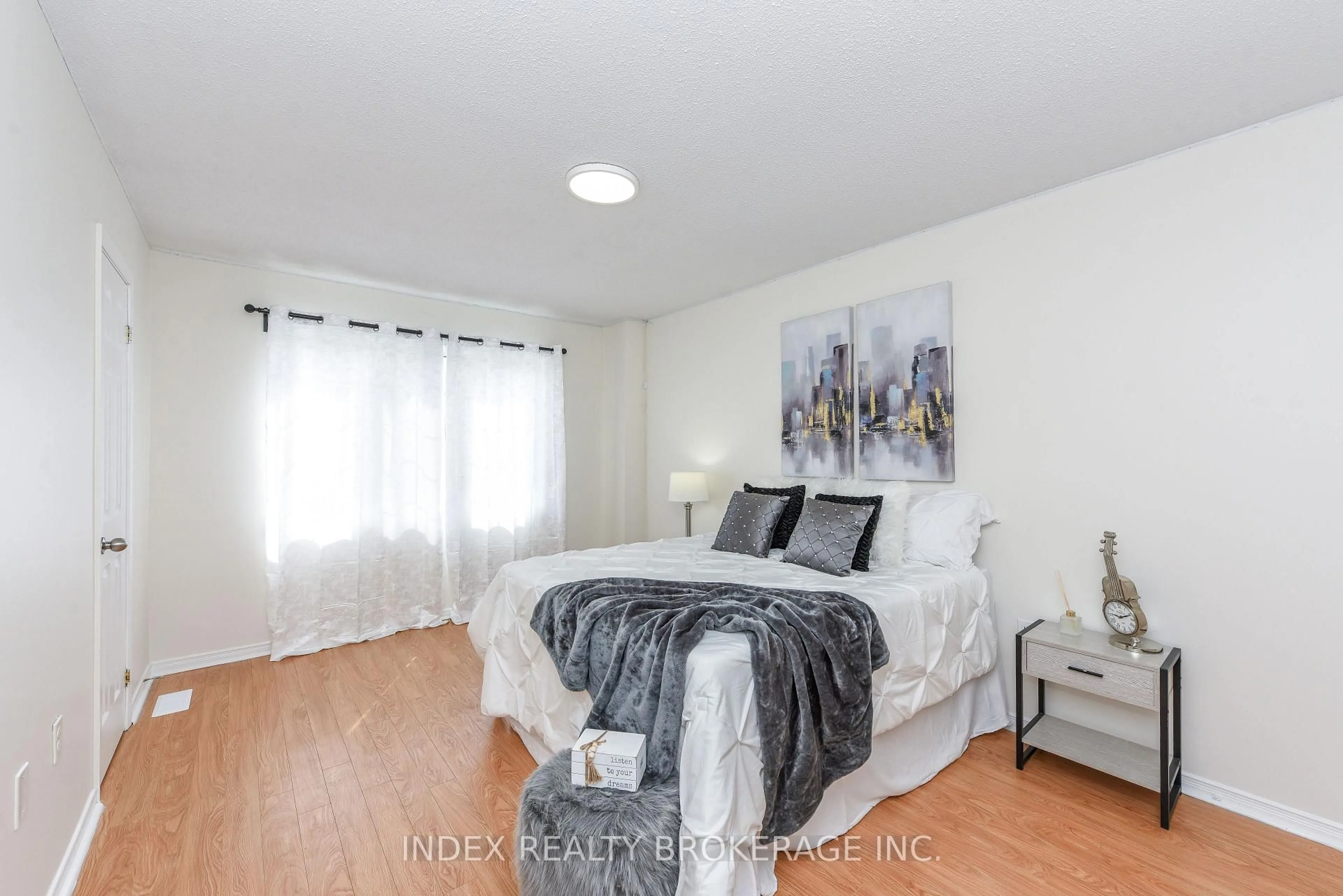 Bedroom with bed, wood/laminate floor for 7155 Magistrate Terr #145, Mississauga Ontario L5N 1Y9
